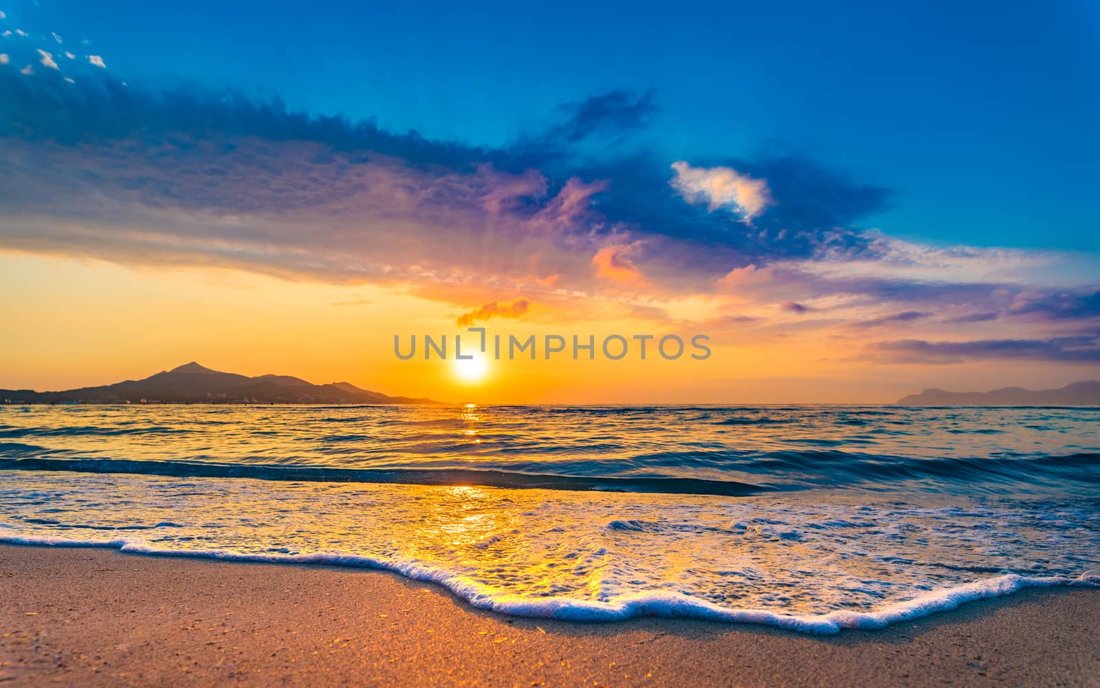 Sunrise at beach with beautiful sunlight sea water reflection and idyllic sun at sky horizon background  by Vulcano