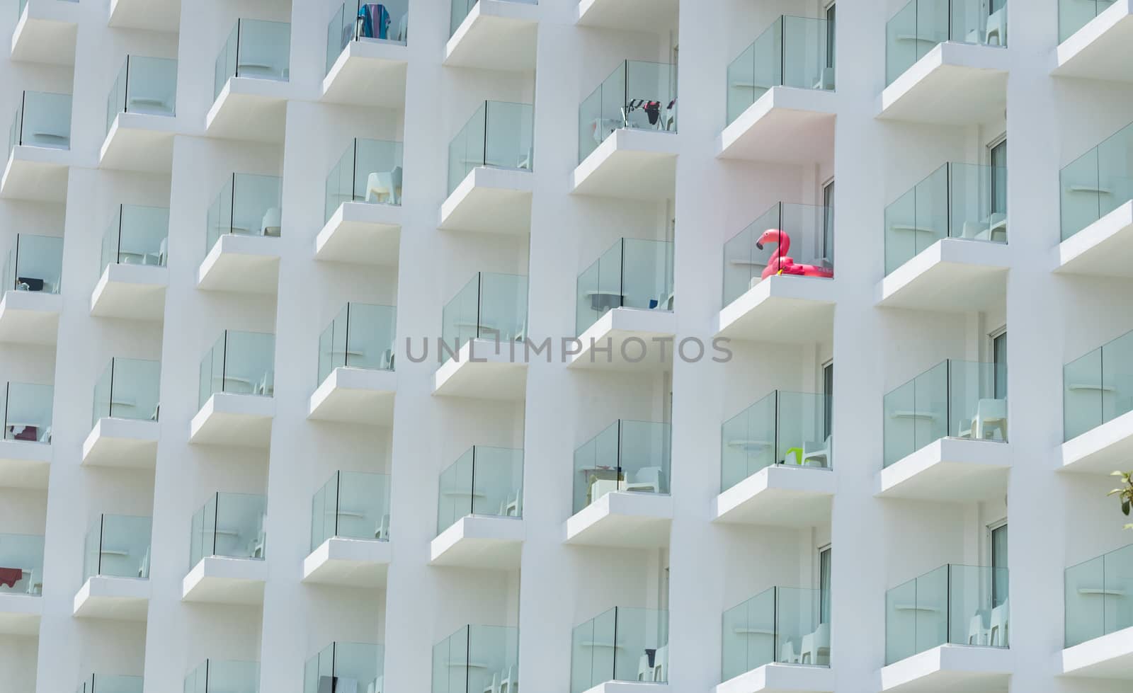 Summer holiday tourism hotel facade with balcony front