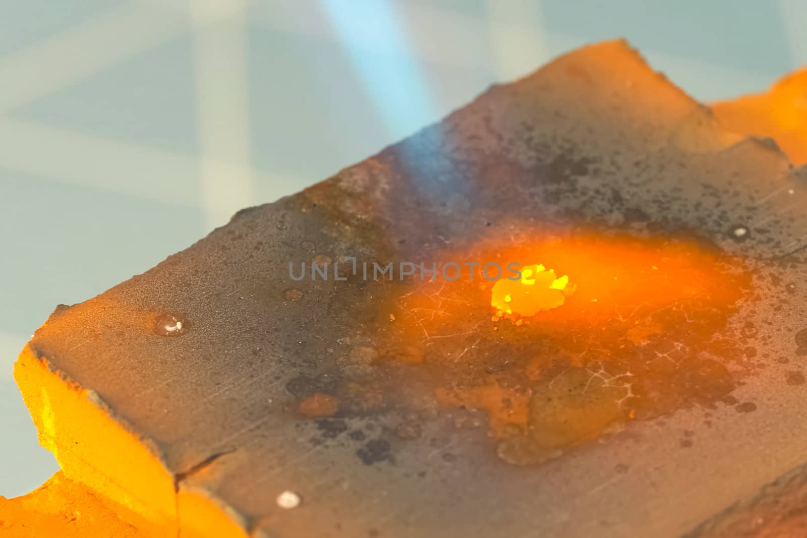 Gold smelting from slag using a gas burner.