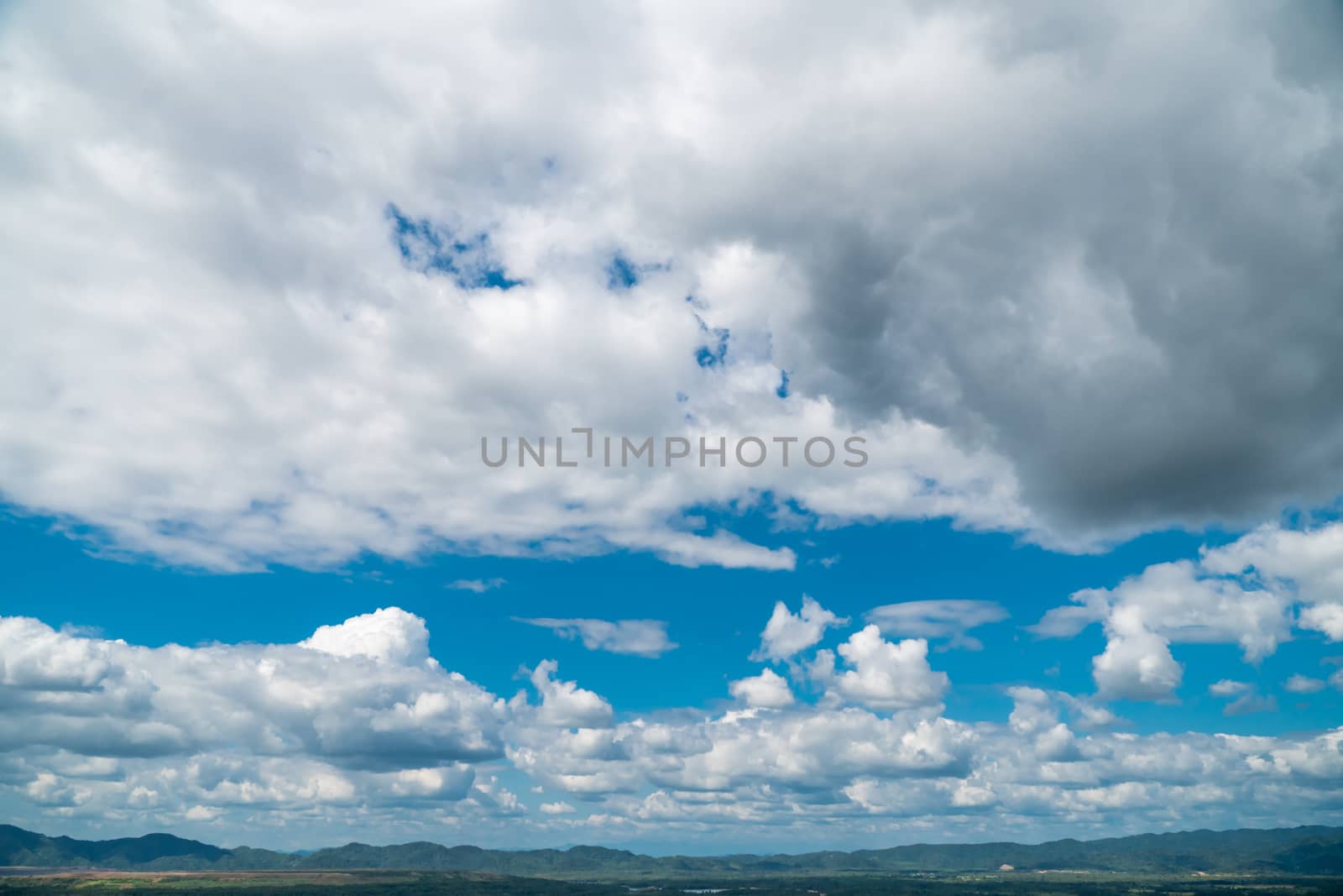 Cloudy skies and mountains in the moist forest