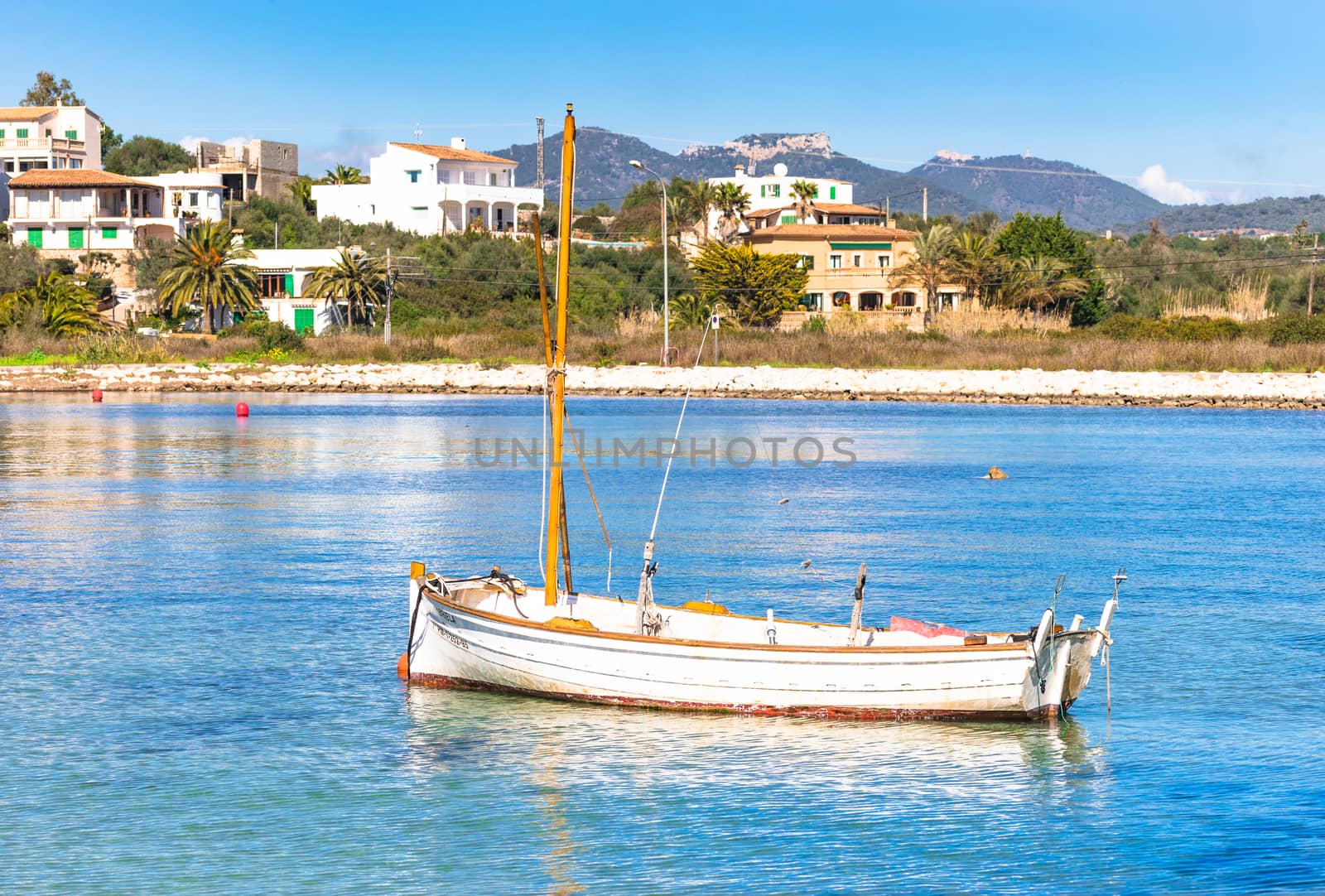 Romantic view of old fishing boat at coast of Portopetro on Mallorca island, Spain Mediterranean Sea