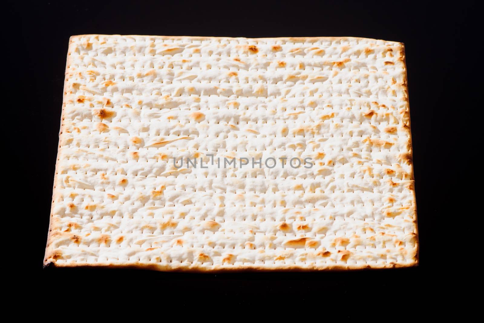 Matzo - A traditional Jewish Passover bread on a black background