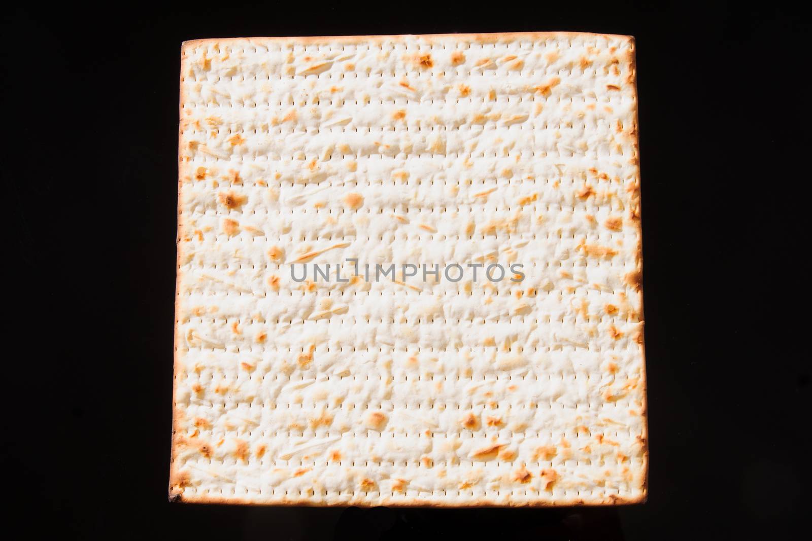 Matzo - A traditional Jewish Passover bread on a black background
