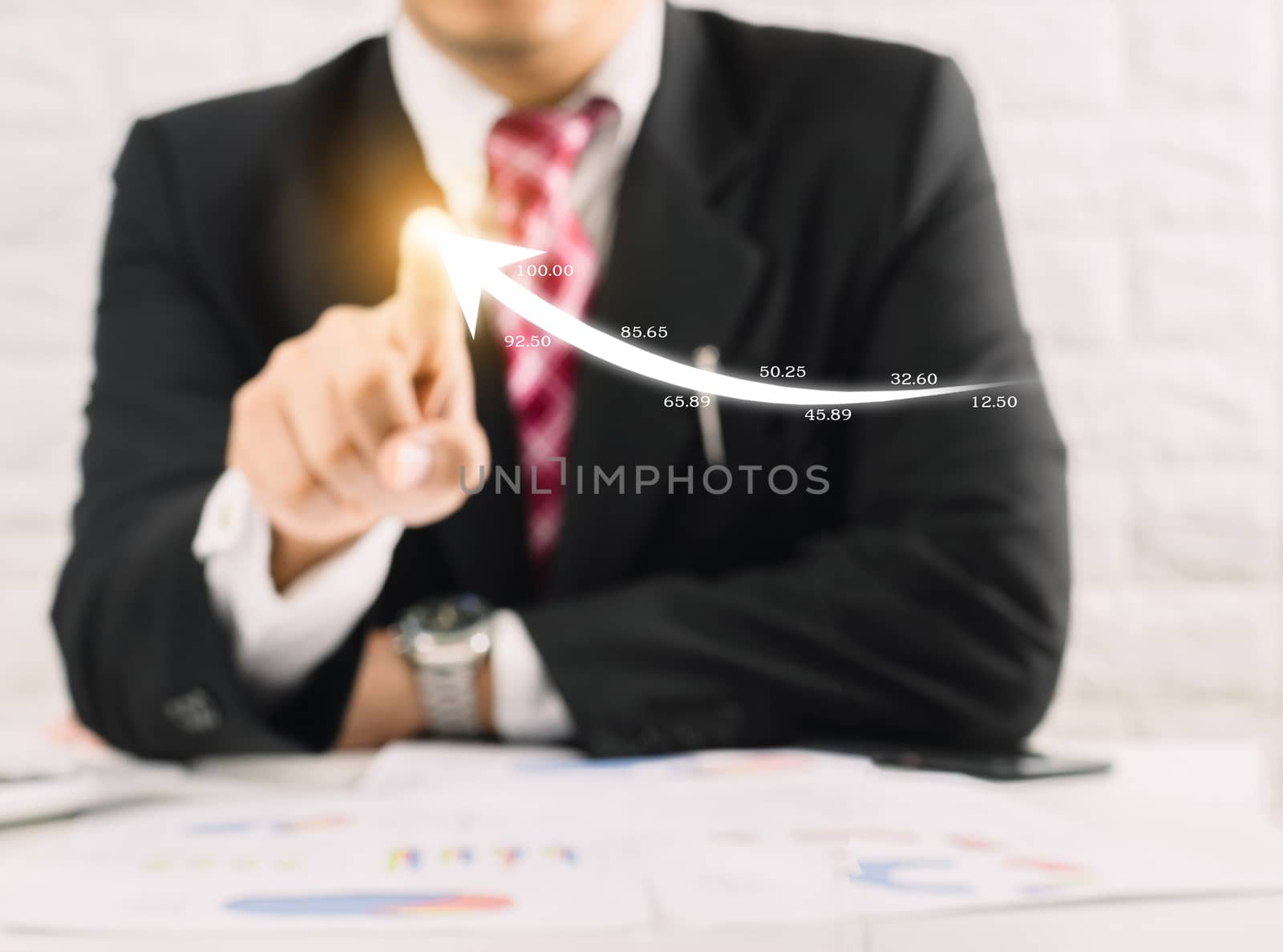 Businessman concepts hands pointing finger touch screen an arrow graph and chart