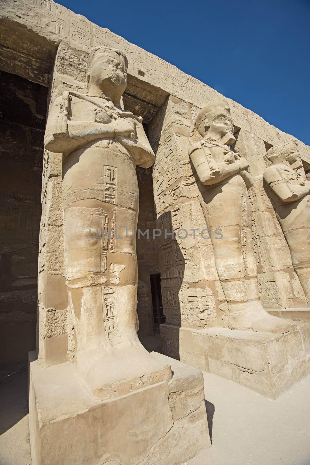 Large statue of Ramses III in ancient egyptian Karnak Temple at Luxor