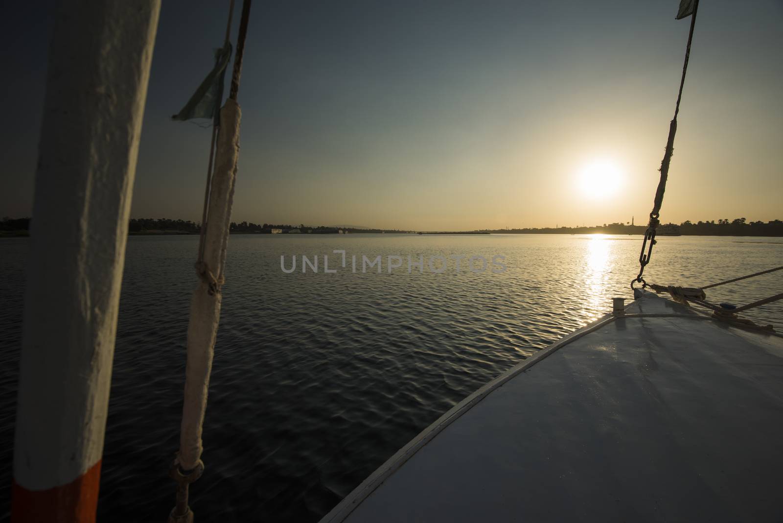 View of river nile in Egypt from sailing boat at sunset by paulvinten