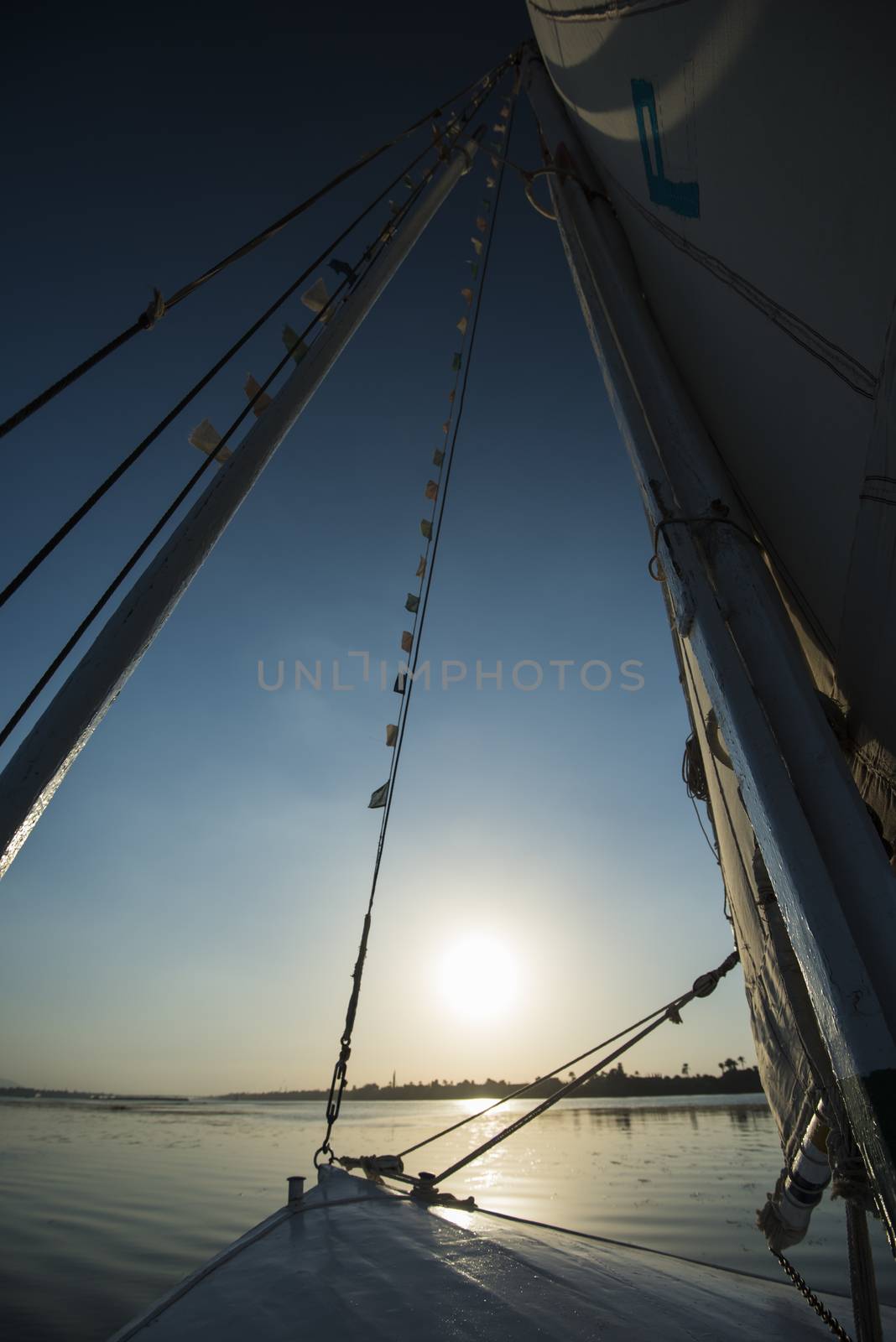 View of river nile in Egypt from sailing boat at sunset by paulvinten