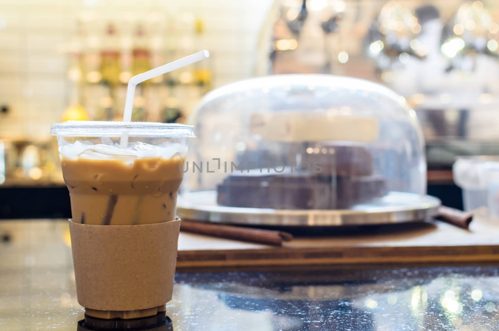 A glass of ice coffee on the counter bar ready for serve and enjoying on drinking time.