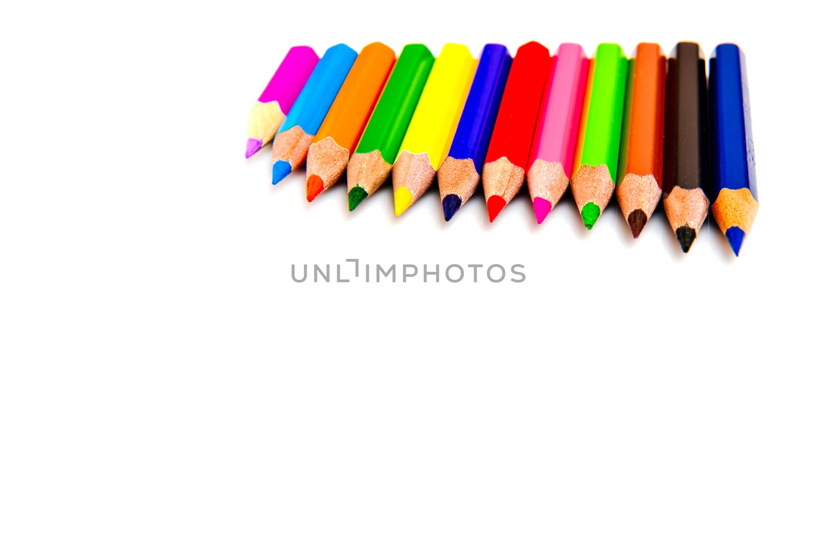 Multicolored pencils isolated on white background. School supplies. by leonik