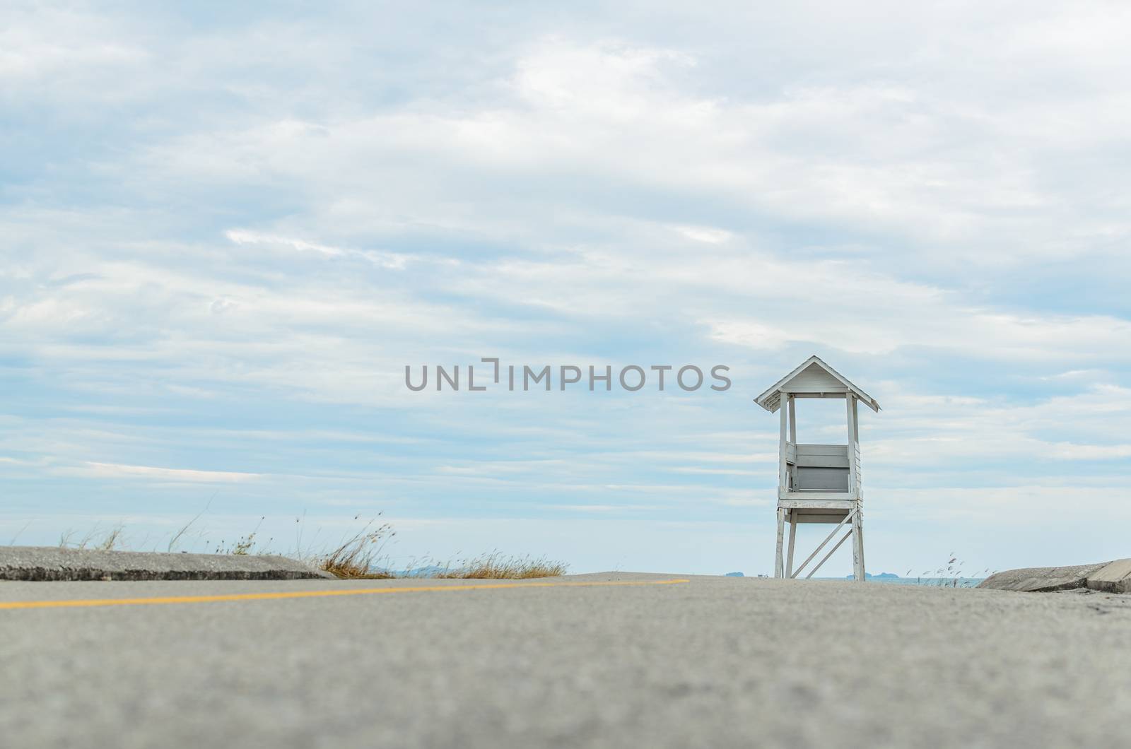 Tower on the road under the blue sky.