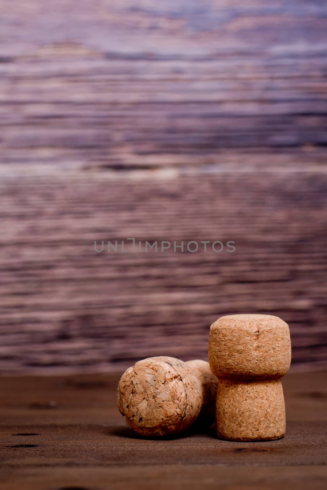 Wine corks on a wooden background.