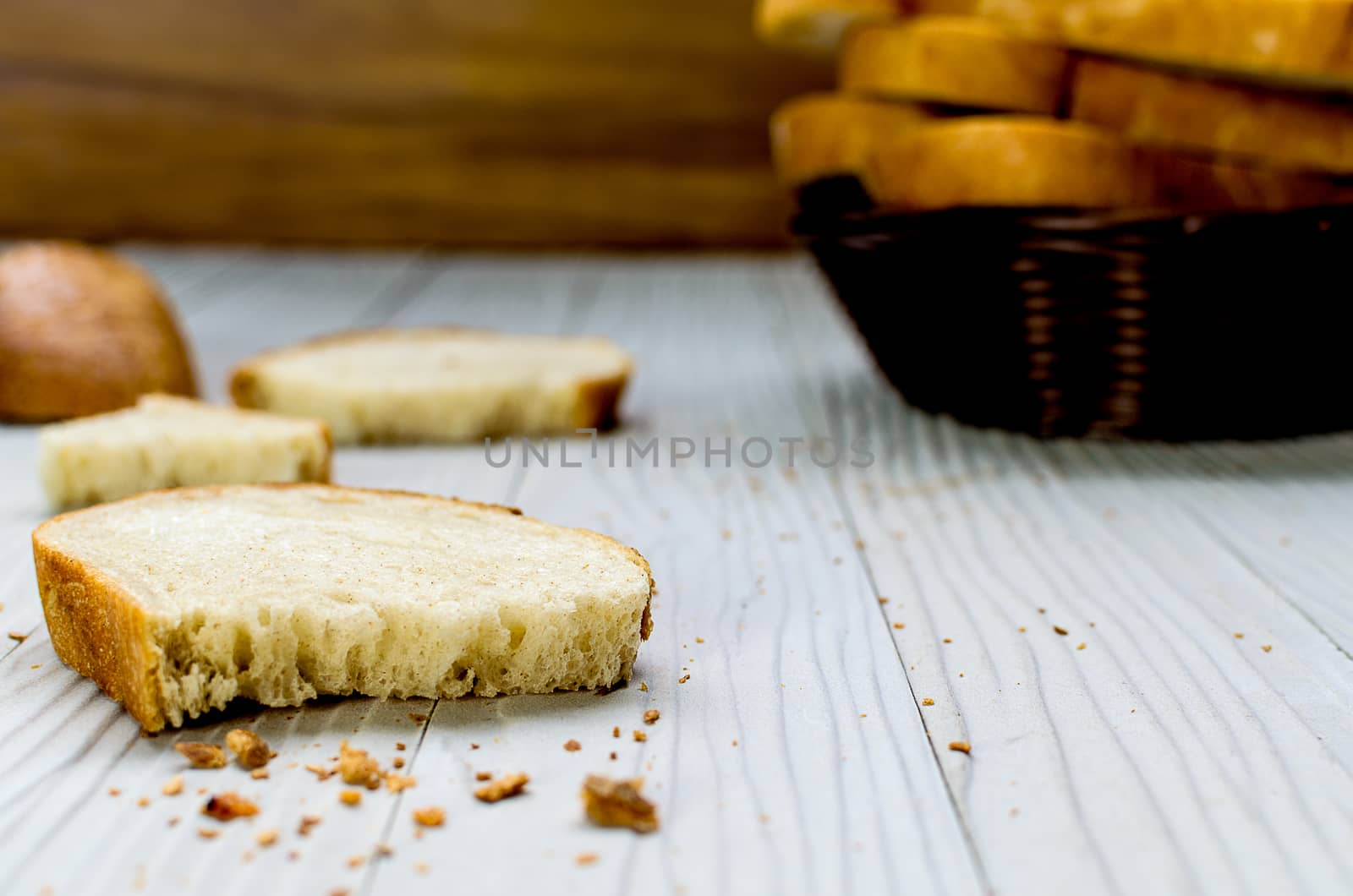 A Sliced Pain De Campagne Au Levain Bread in the wicker brown wood basket bowl.