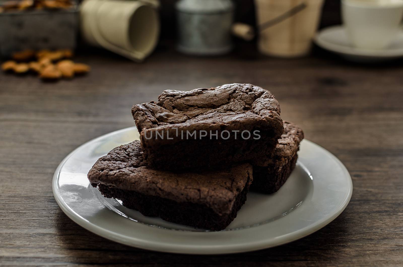 The Chocolate Brownie with Almonds and Coffee on the pallet wood has ready to served in the dessert time.