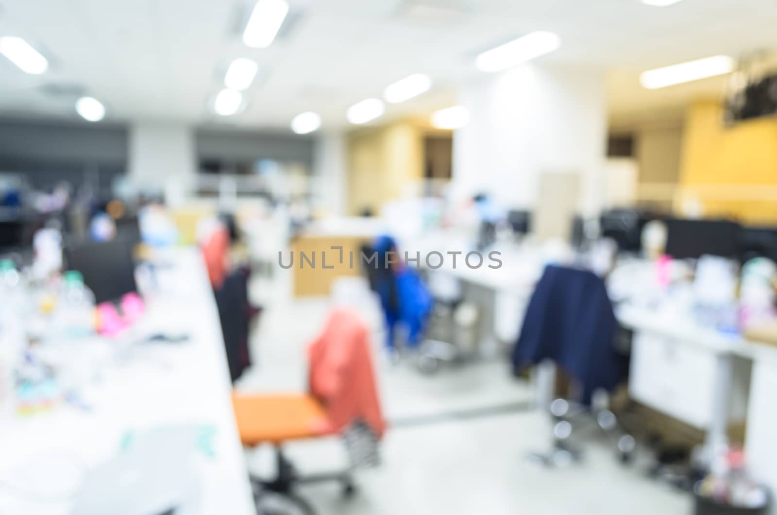 office work room blurred in the workplace. Table top and blurred Office of Background blur table work in office with computer.Abstract background of office, shallow depth of focus,monitor