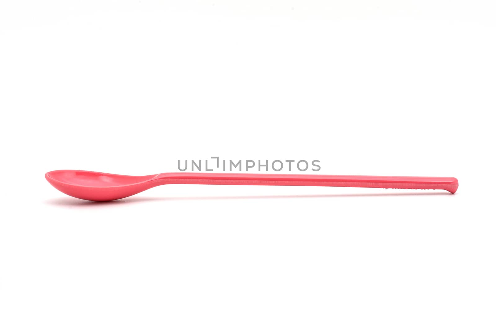 A Pink Spoon isolated on white backgroud.