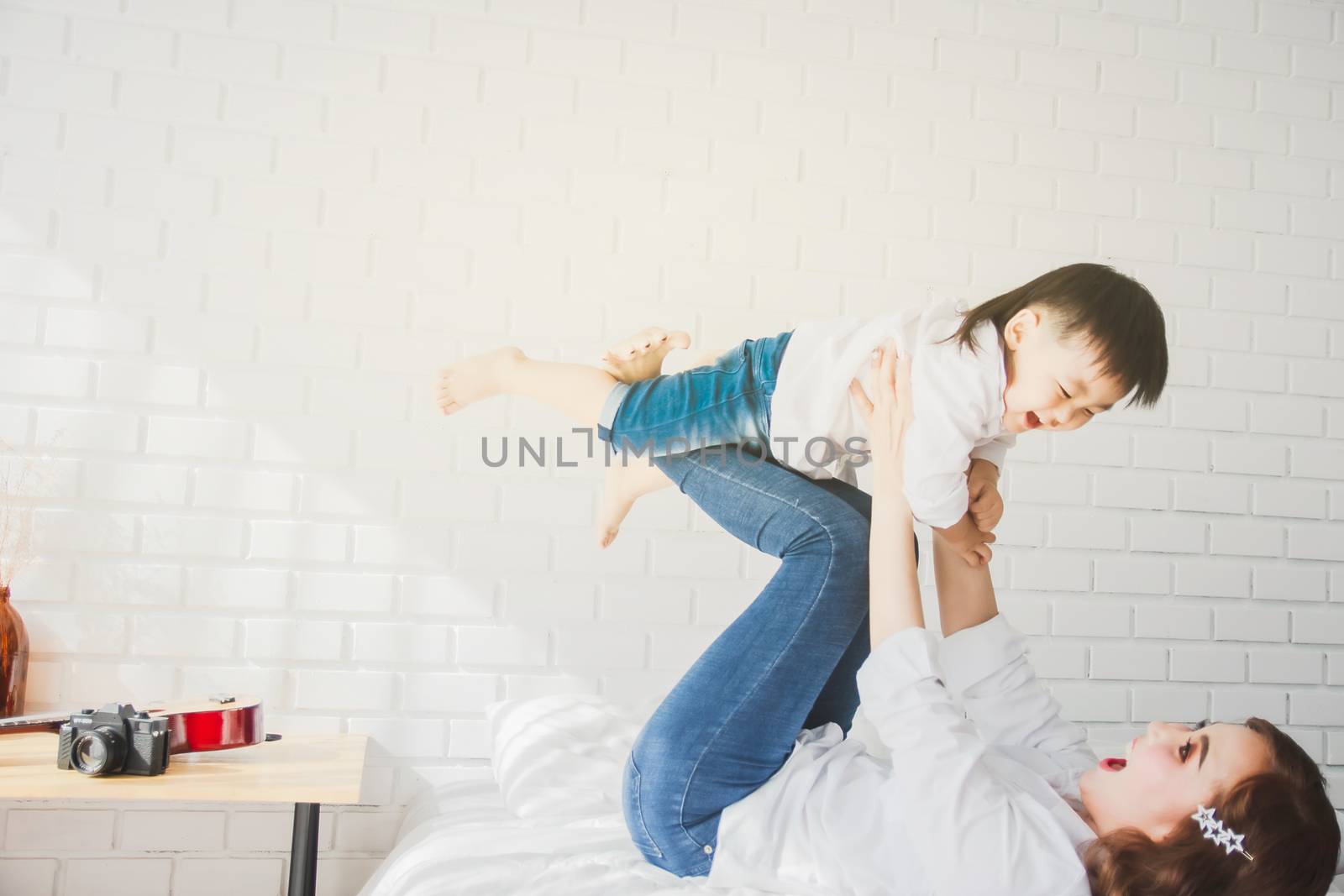 Asian Japanese Family father mother son wearing white shirt carr by oatzpenzstudio