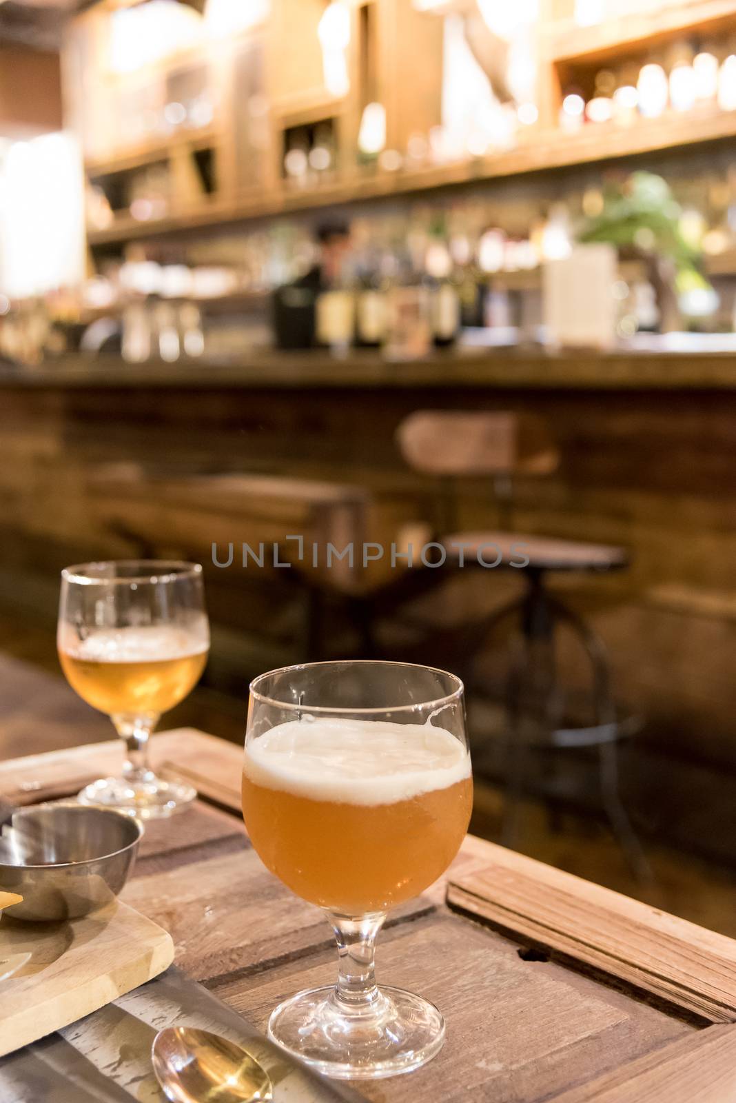 Drinking beer in the pub and restaurant cafe with blur bar backg by animagesdesign