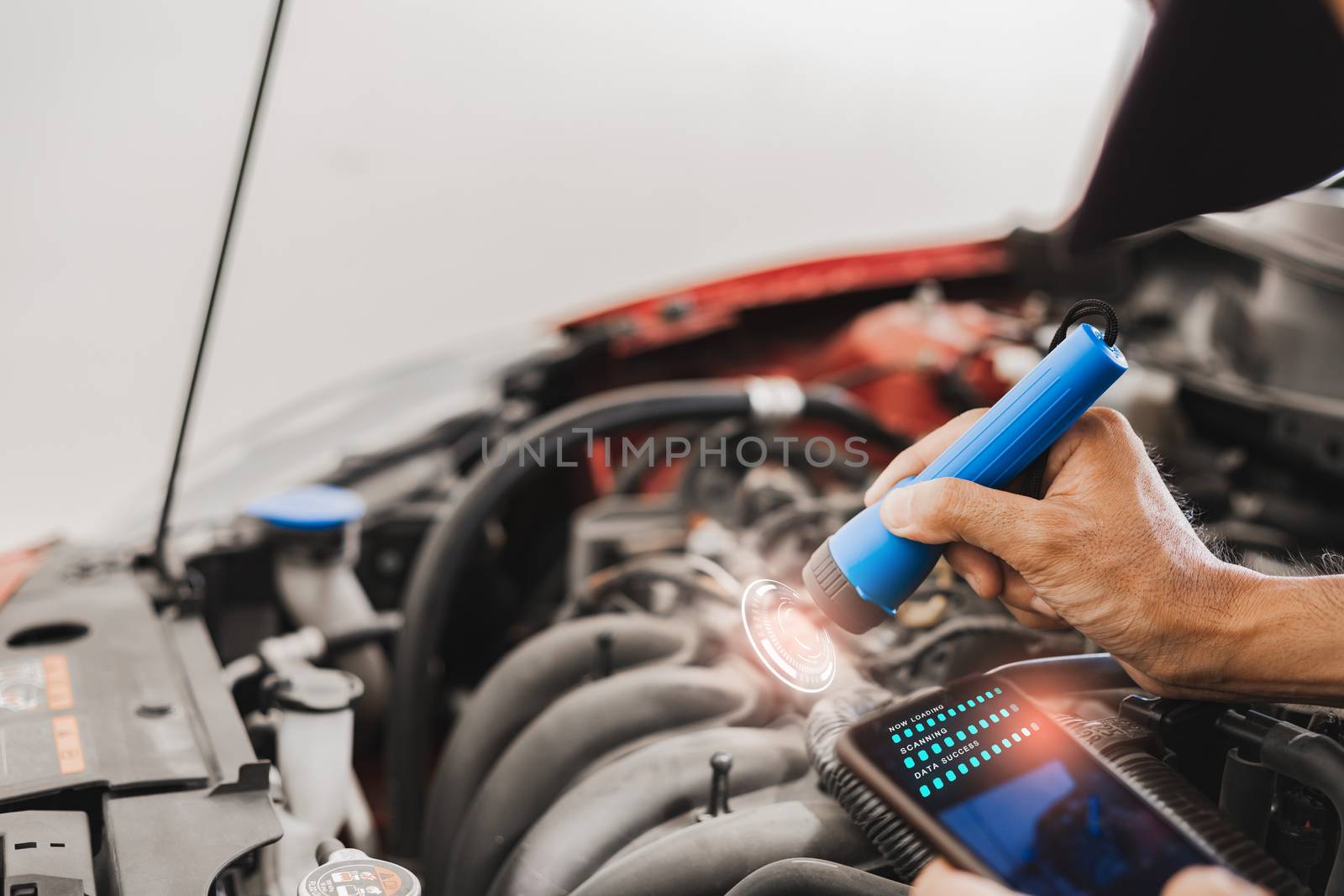 Asian Man mechanic inspection Shine a torch car engine checking bug in engine from application smartphone.Red car for service maintenance insurance with car engine.for transport automobile automotive