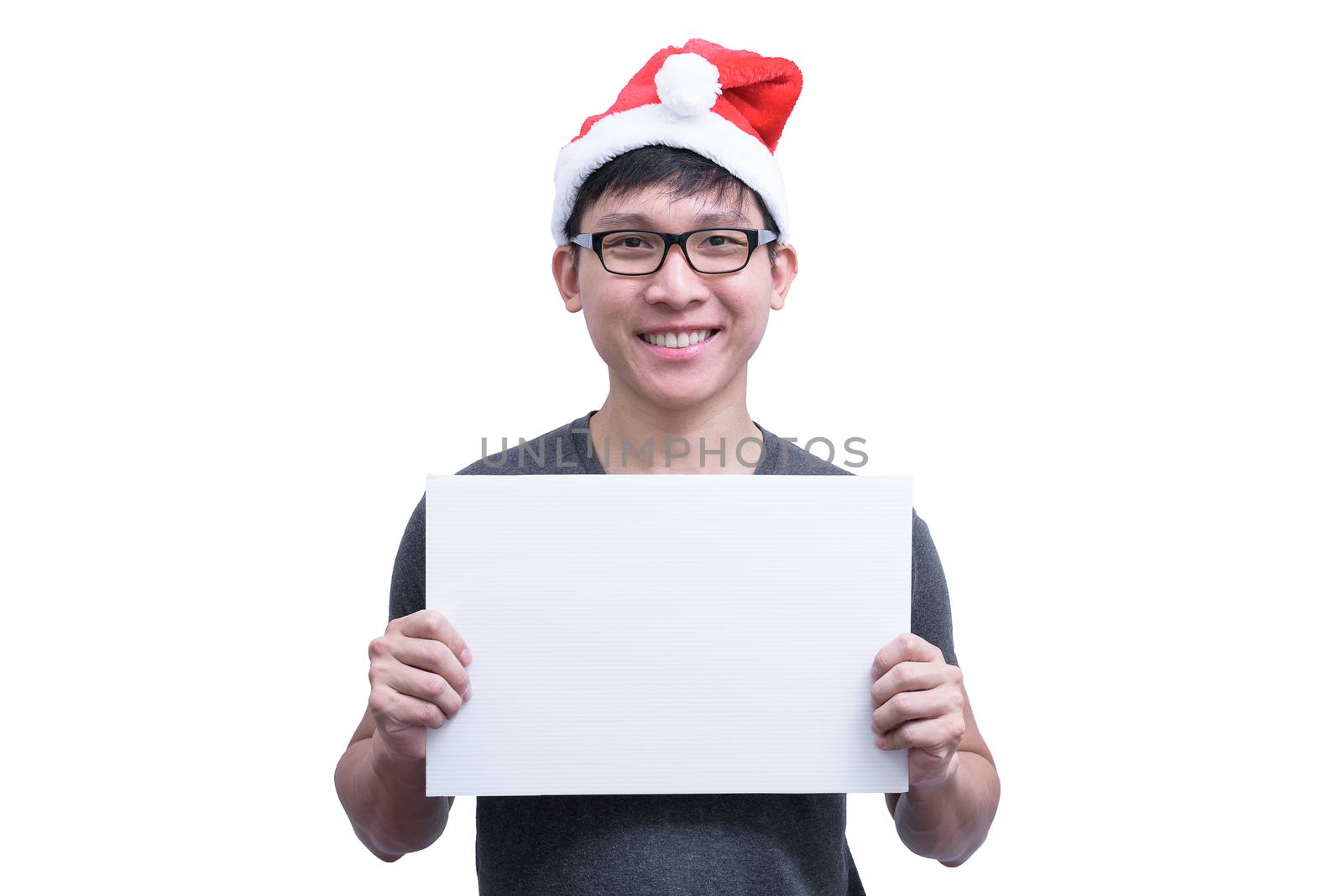 Asian Santa Claus man with eyeglasses and grey shirt has holding a white blank advertisement banner isolated on white background with copy space.