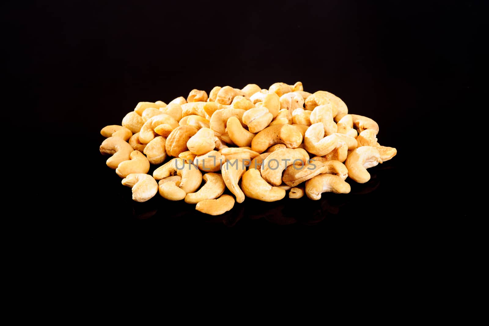 Raw Cashew Nuts on a black background