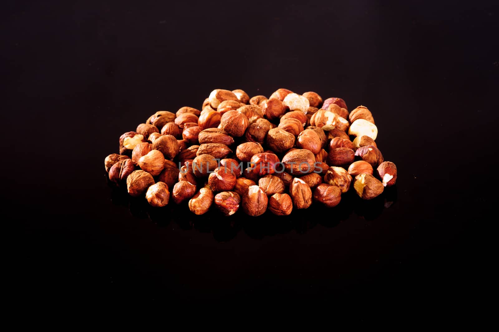 Hazelnuts on a black background