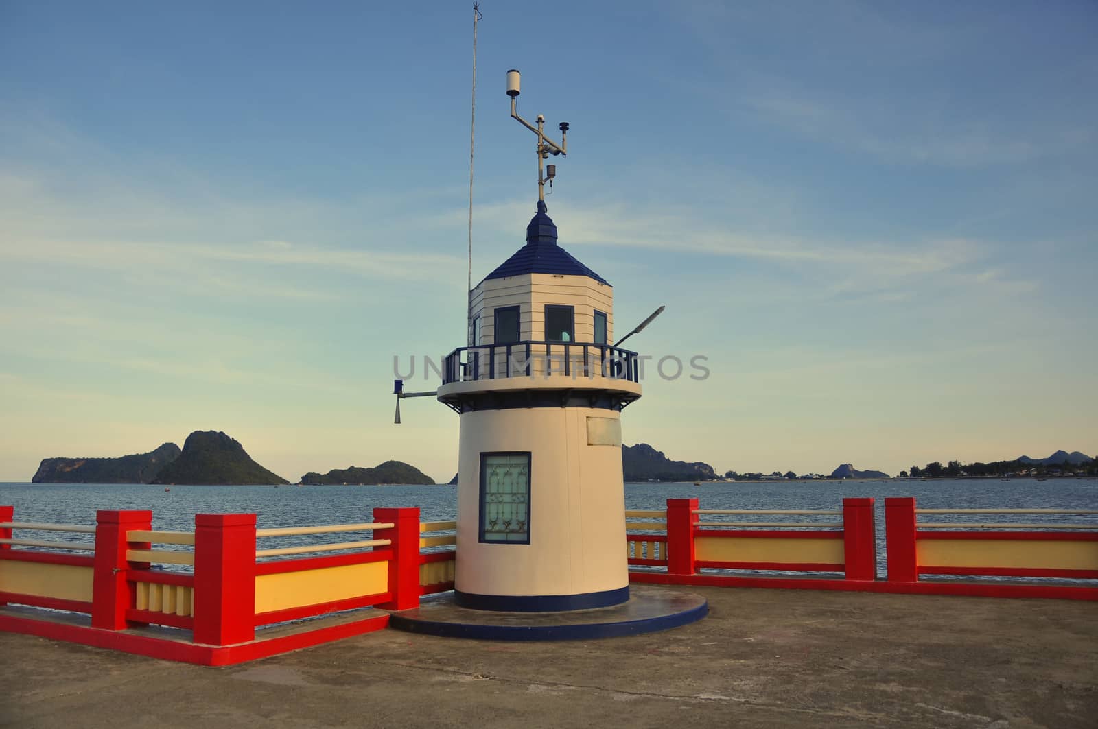 White lighthouse With sea and islands in the background