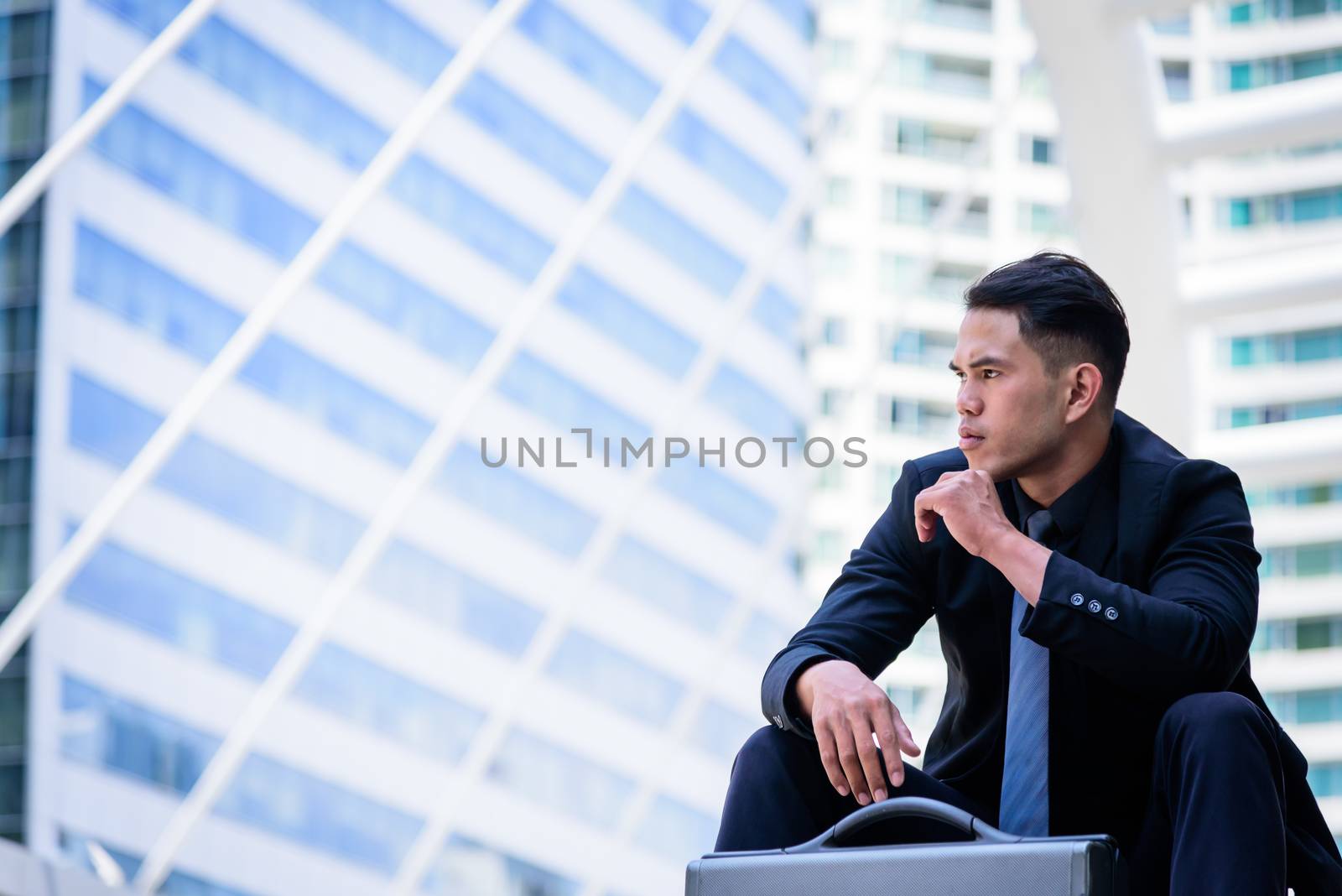 The asian businessman has thinking and looking forward to the fu by animagesdesign