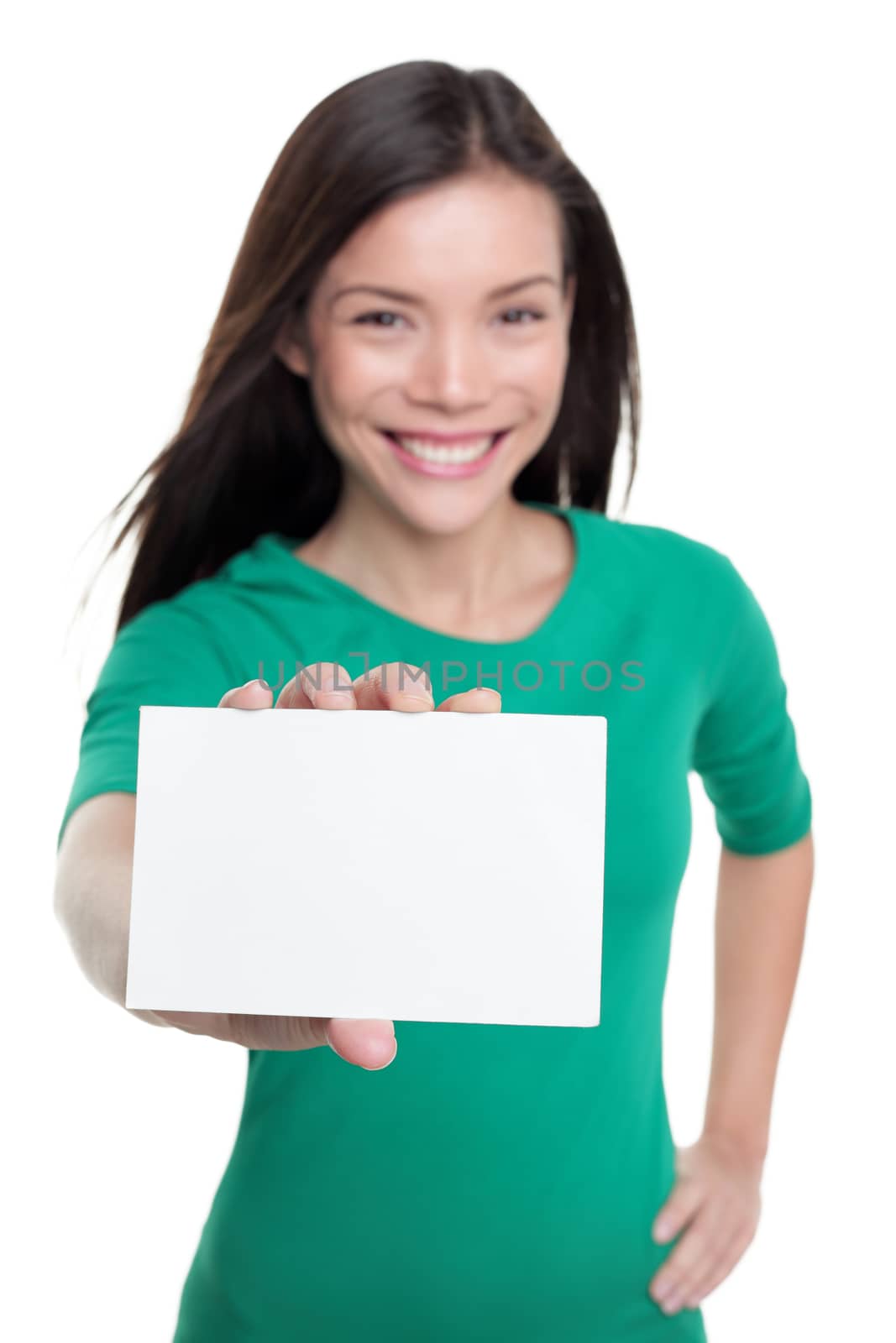 Happy Asian woman showing white business card sign. Young casual girl holding blank paper for text advertising copyspace.