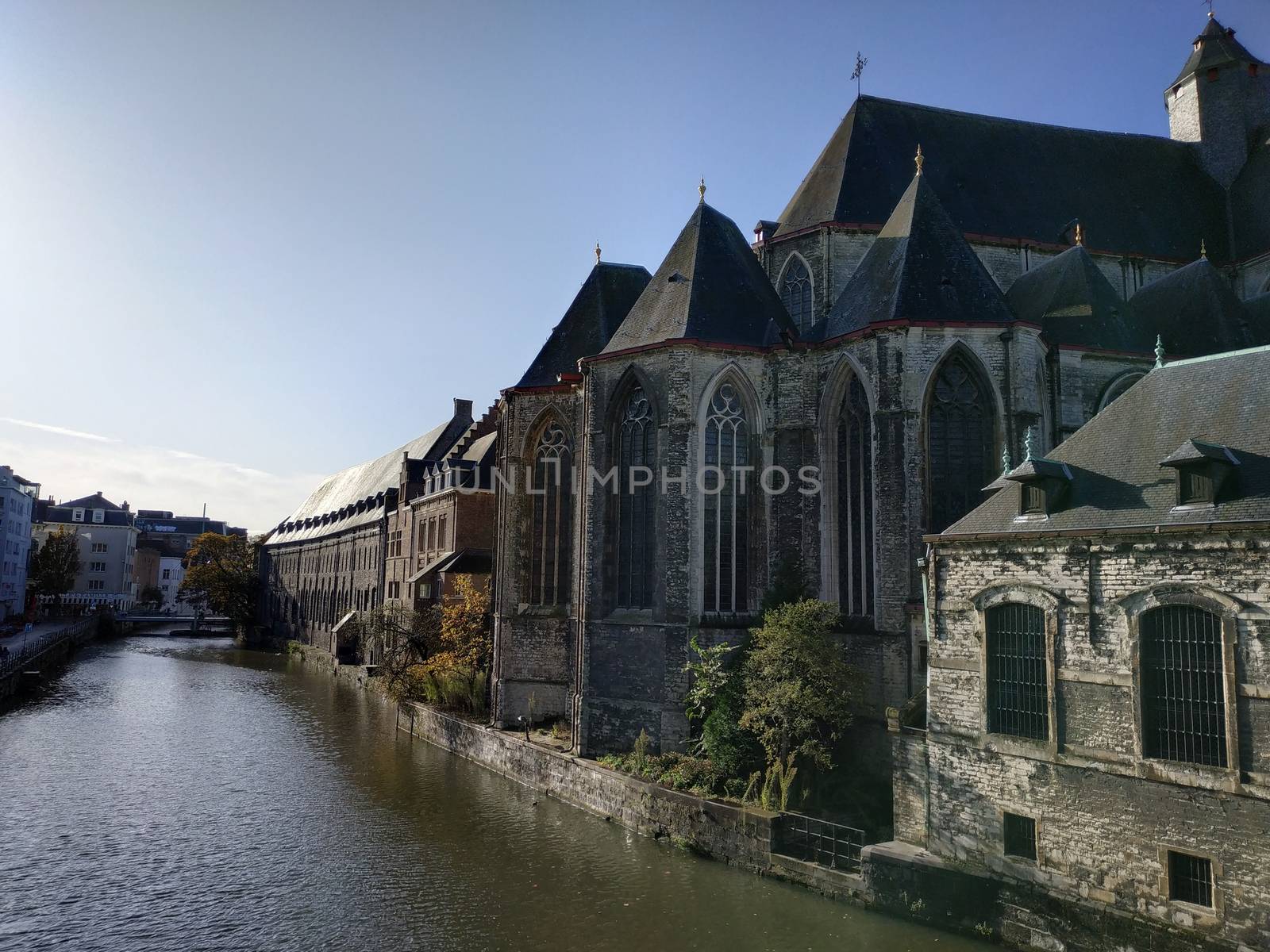 Ghent, Belgium - November 02, 2019: view on the streets and roads with tourists walking around by VIIIPhoto