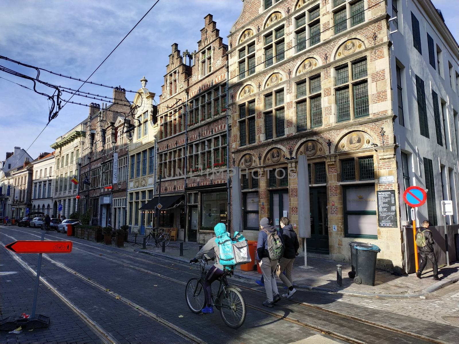 Ghent, Belgium - November 02, 2019: view on the streets and roads with tourists walking around by VIIIPhoto