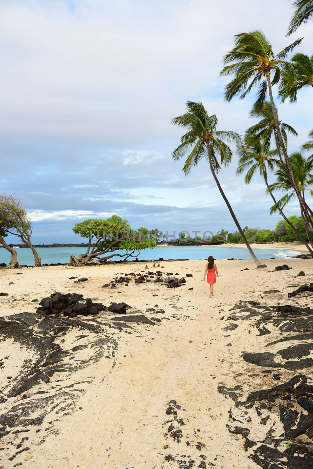 Hawaii beach vacation woman walking on secluded white sand beach on Big island of Hawaii, USA travel by Maridav