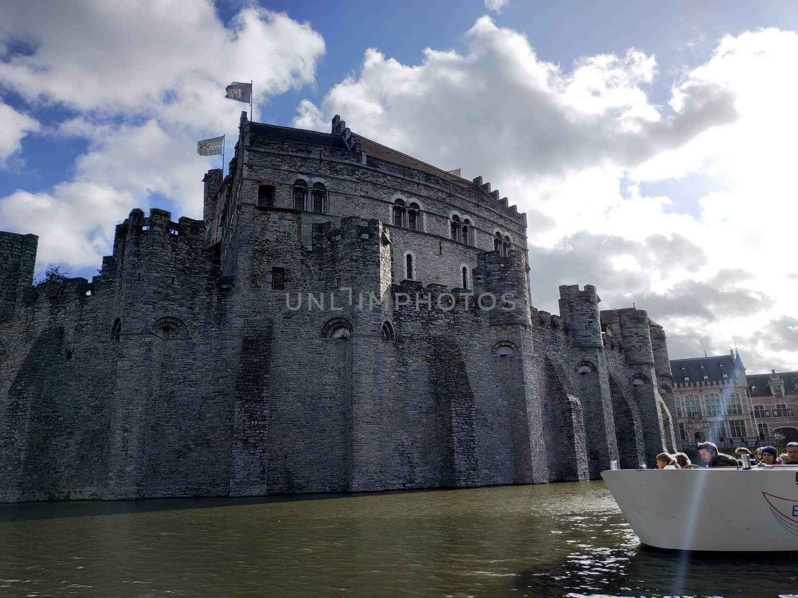 Ghent, Belgium - November 02, 2019: view on the streets and roads with tourists walking around by VIIIPhoto