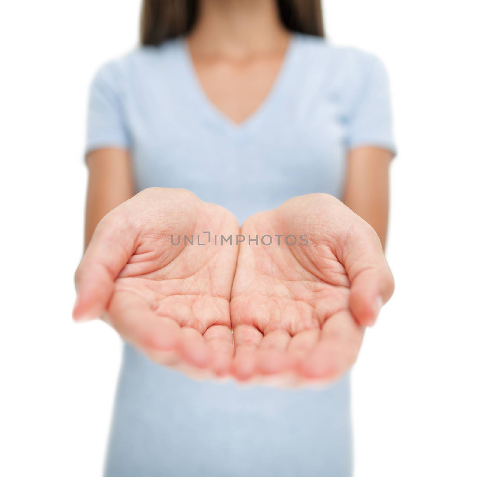 Showing open empty hands woman for holding product object, copyspace. Cupped hands. Giving, charity, donation concept by Maridav