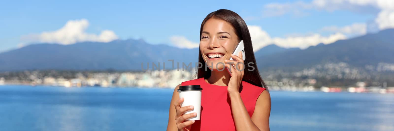 Happy woman talking on the phone while drinking coffee outdoor in summer sun banner crop for advertising copyspace, landscape of Vancouver in background. Work lifestyle, success in career girl.