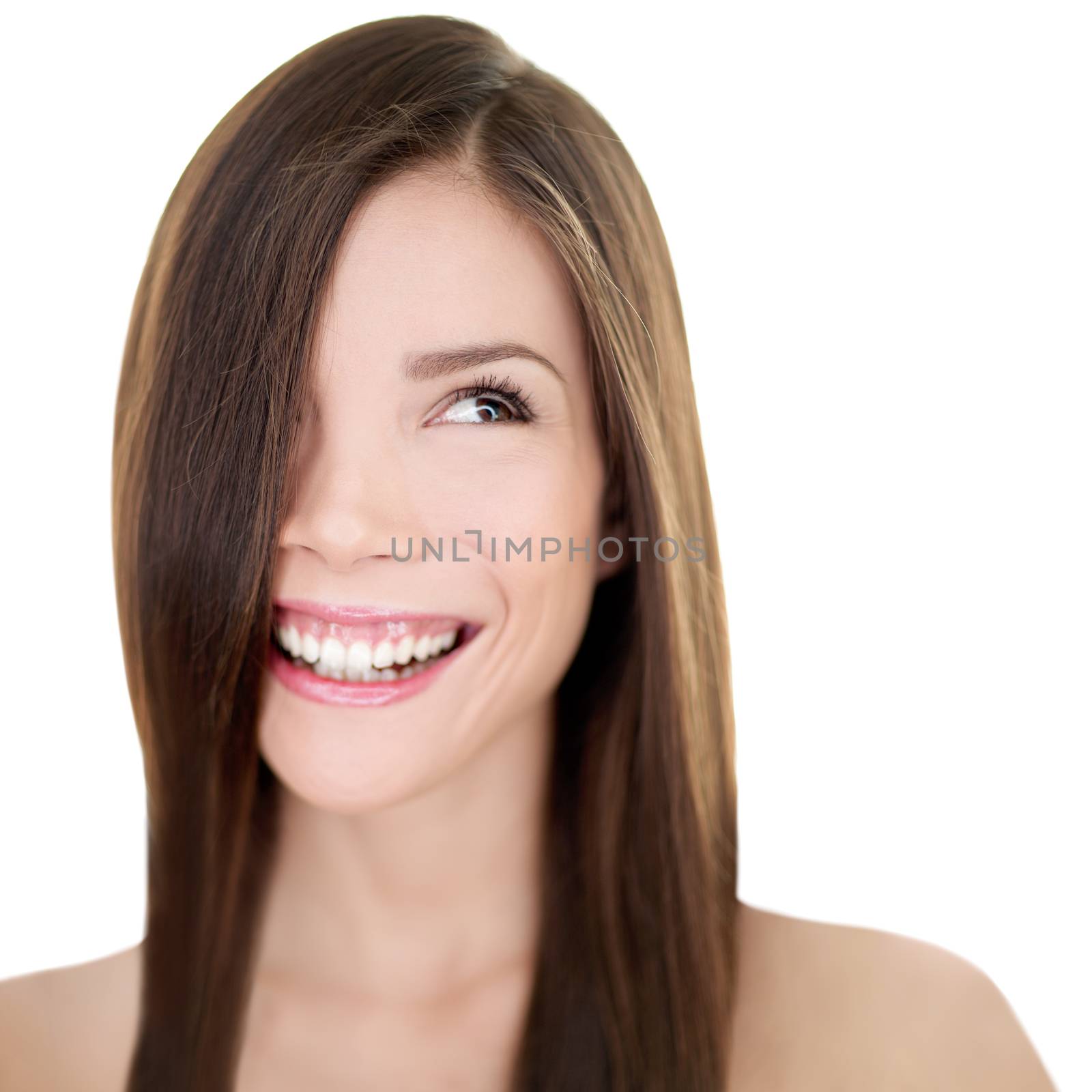 Hair care Asian woman smiling looking at white background copyspace. Beautiful girl with long straight brown hair for haircut or hairstyle beauty salon concept. Happy natural smile person by Maridav