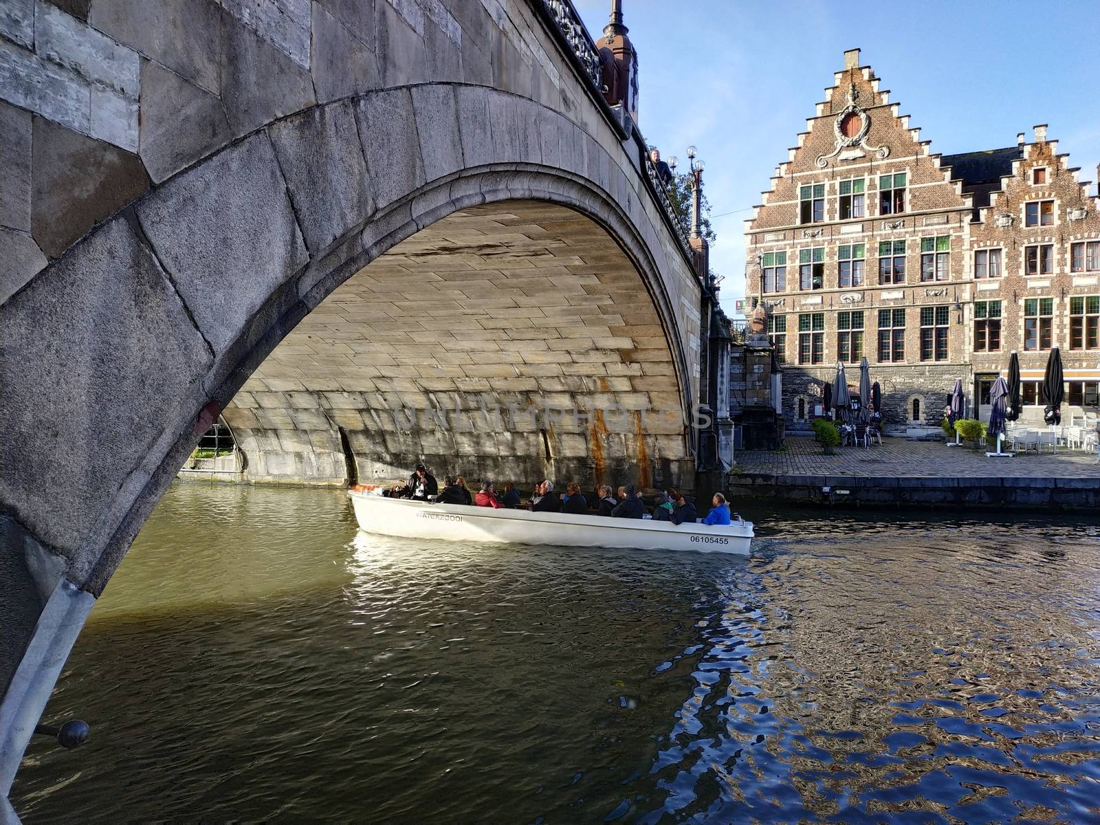 Ghent, Belgium - November 02, 2019: view on the streets and roads with tourists walking around by VIIIPhoto