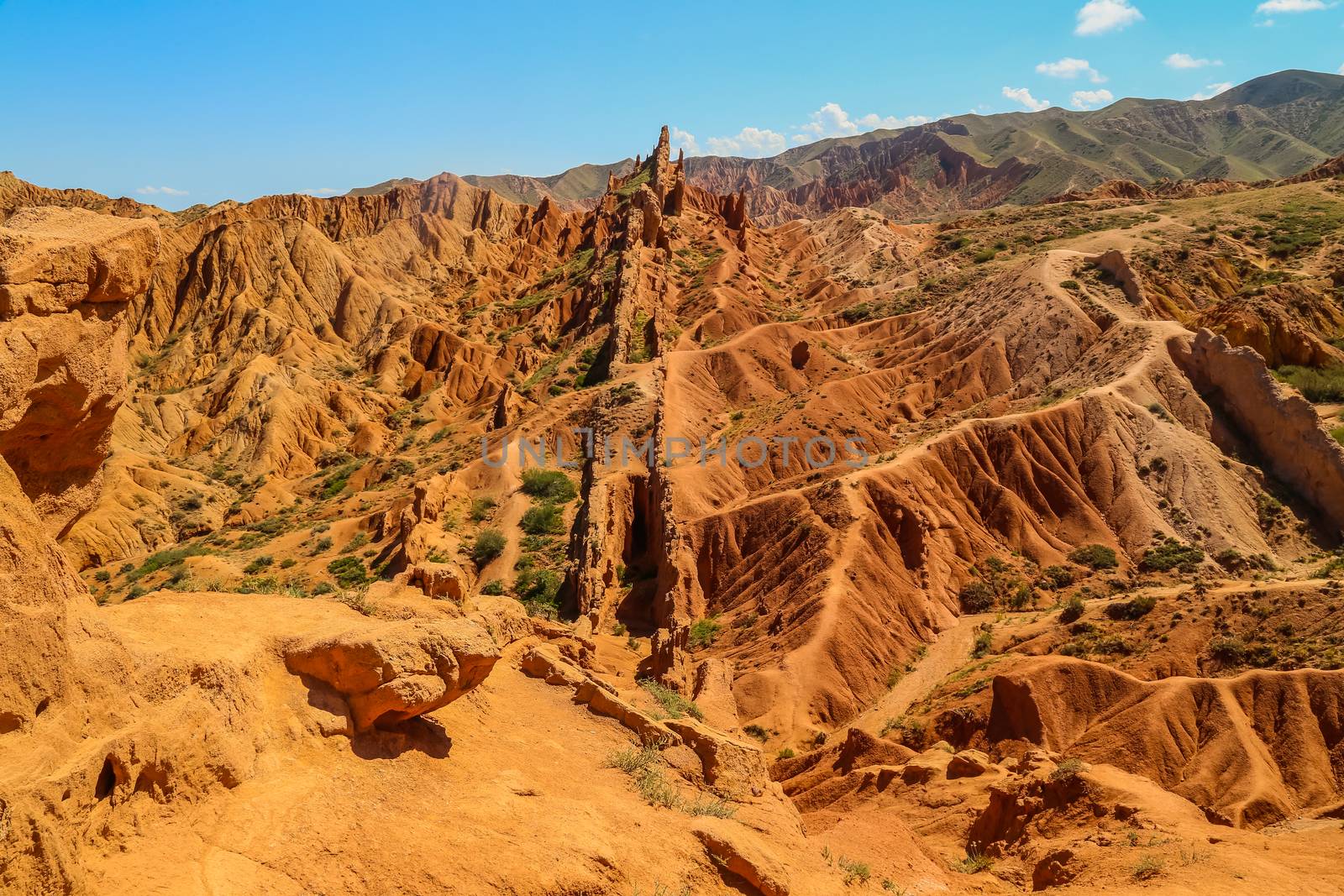 Red sandstone rock formations Seven bulls and Broken heart, Jeti Oguz canyon in Kyrgyzstan, Issyk-Kul region, Central Asia