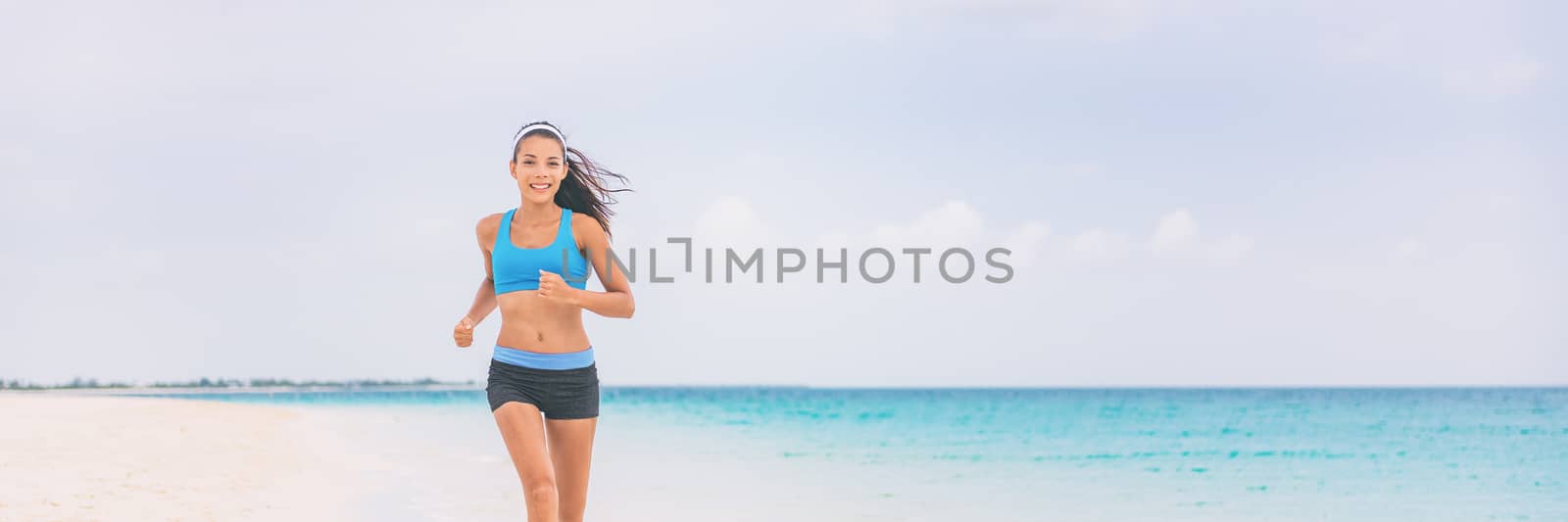 Healthy running girl jogging on beach training cardio. Exercise outside in summer background panorama banner. Asian woman happy morning motivation. Active people lifestyle.