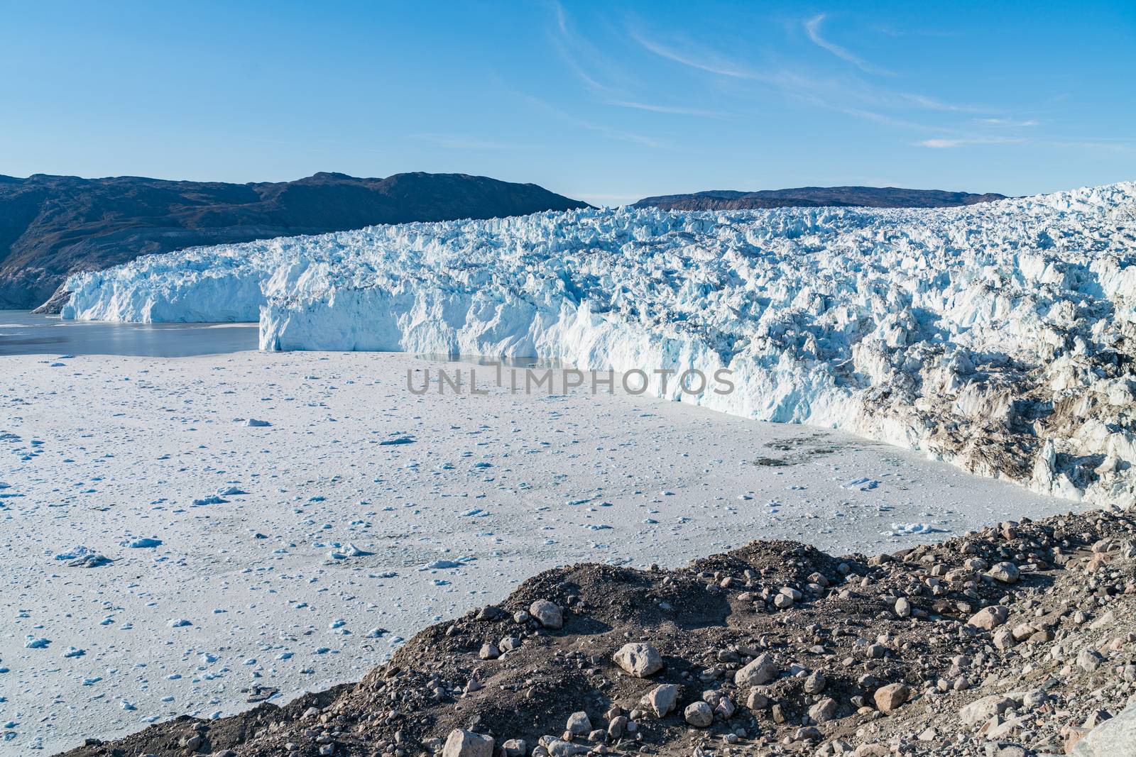 Greenland Glacier front of Eqi glacier in West Greenland AKA Ilulissat and Jakobshavn Glacier. Drains 6.5 percent of the Greenland ice sheet, Heavlly affected by Climate Change and Global Warming