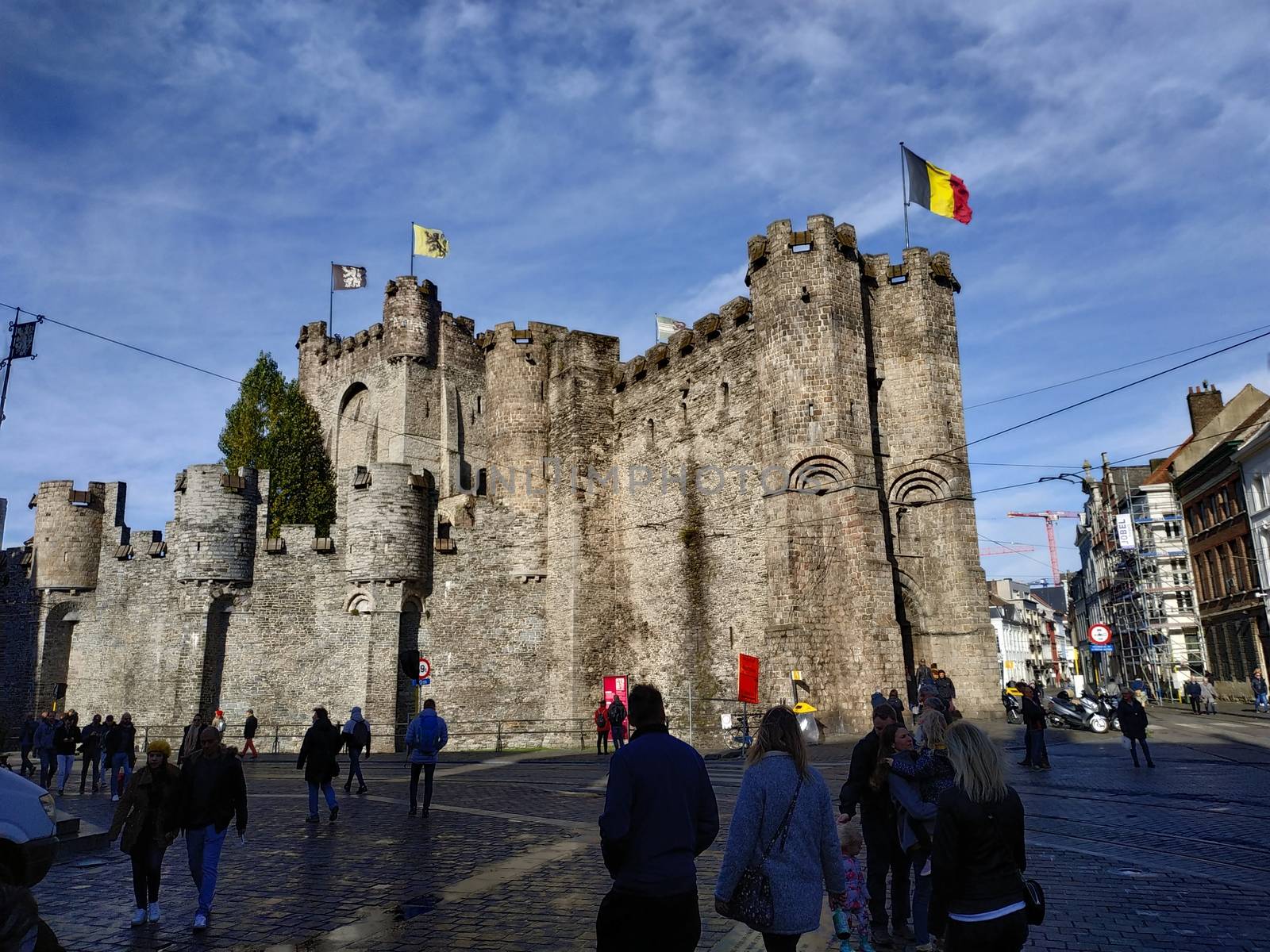 Ghent, Belgium - November 02, 2019: view on the streets and roads with tourists walking around by VIIIPhoto