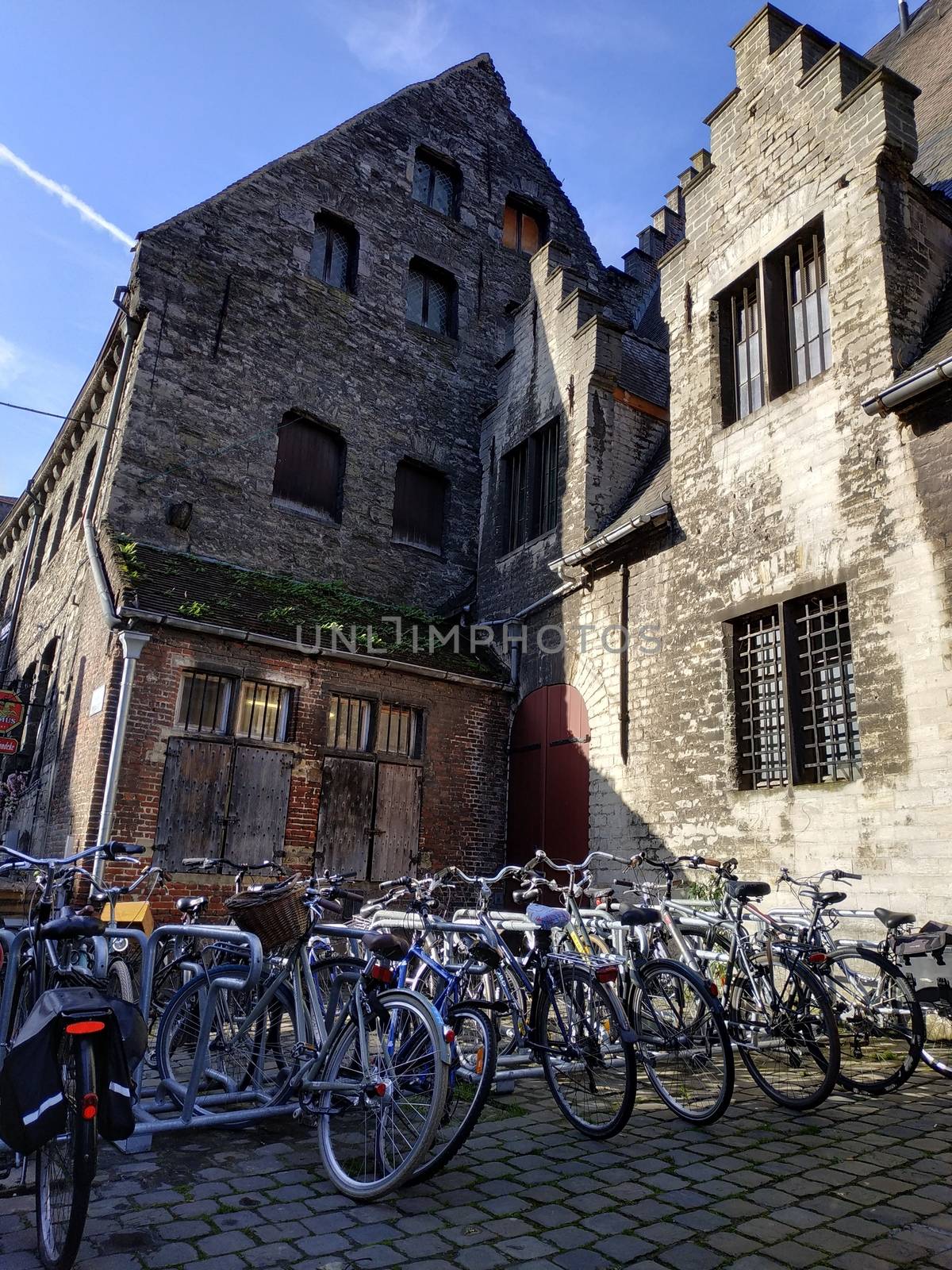 Ghent, Belgium - November 02, 2019: view on the streets and roads with tourists walking around by VIIIPhoto