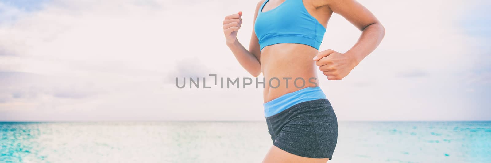Fitness athlete woman runner running training outside jogging on beach. Active healthy lifestyle fit people banner panorama. Stomach lower body for fat burning weight loss treatment by Maridav