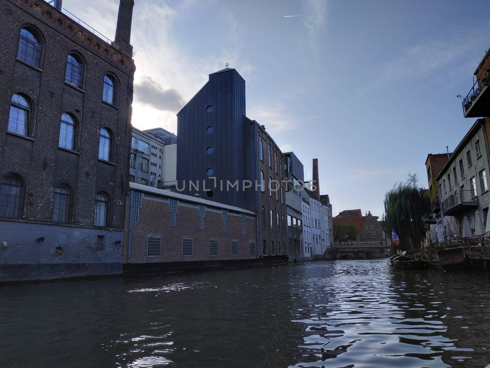 Ghent, Belgium casual view on the buildings streets and roads with tourists walking around by VIIIPhoto