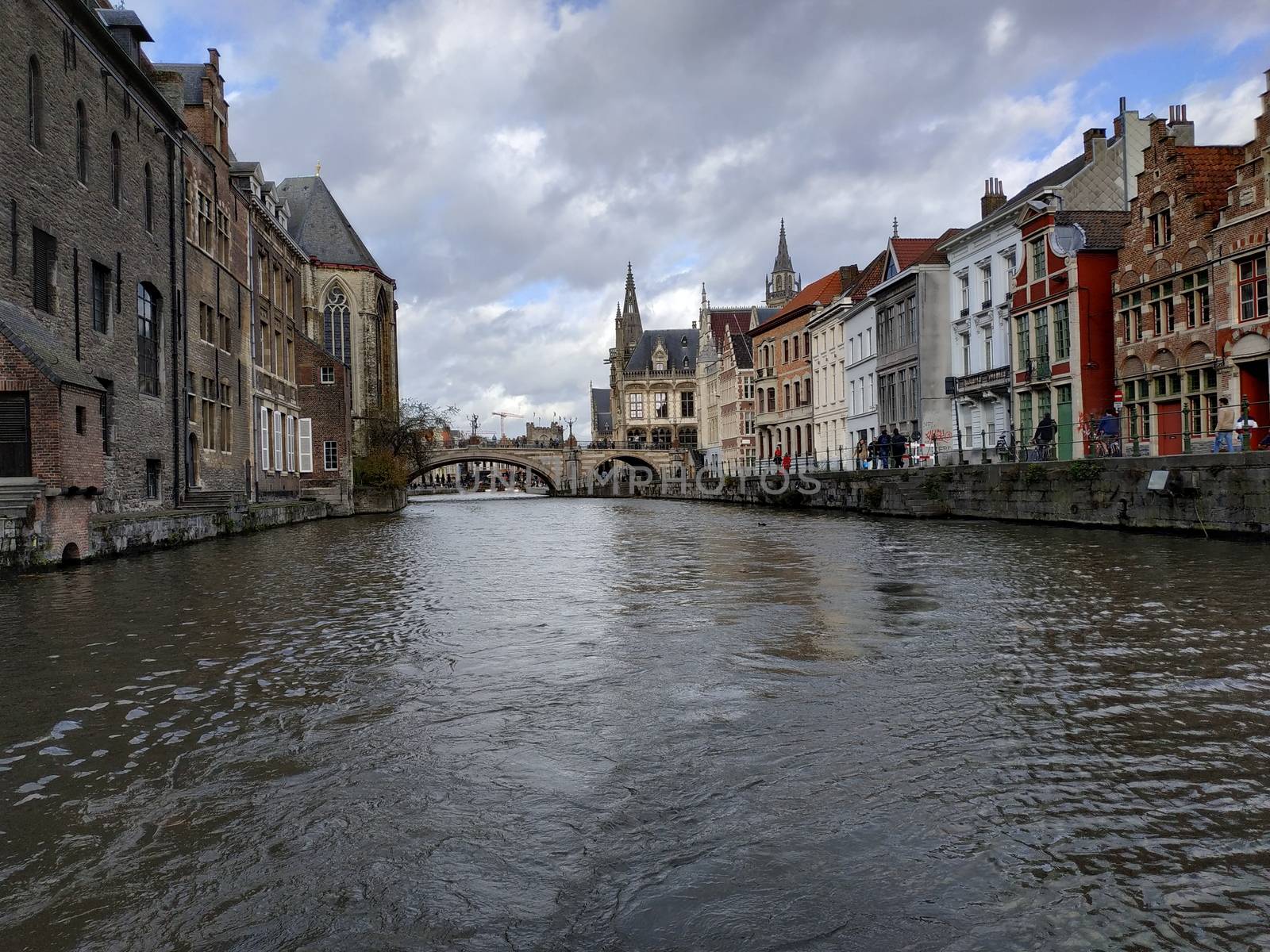 Ghent, Belgium - November 02, 2019: view on the streets and roads with tourists walking around by VIIIPhoto