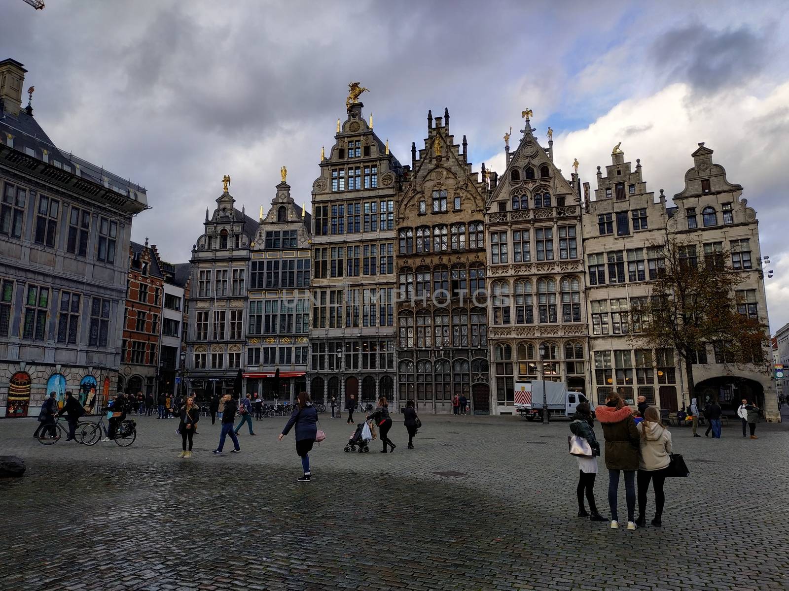 Ghent, Belgium - November 02, 2019: view on the streets and roads with tourists walking around by VIIIPhoto