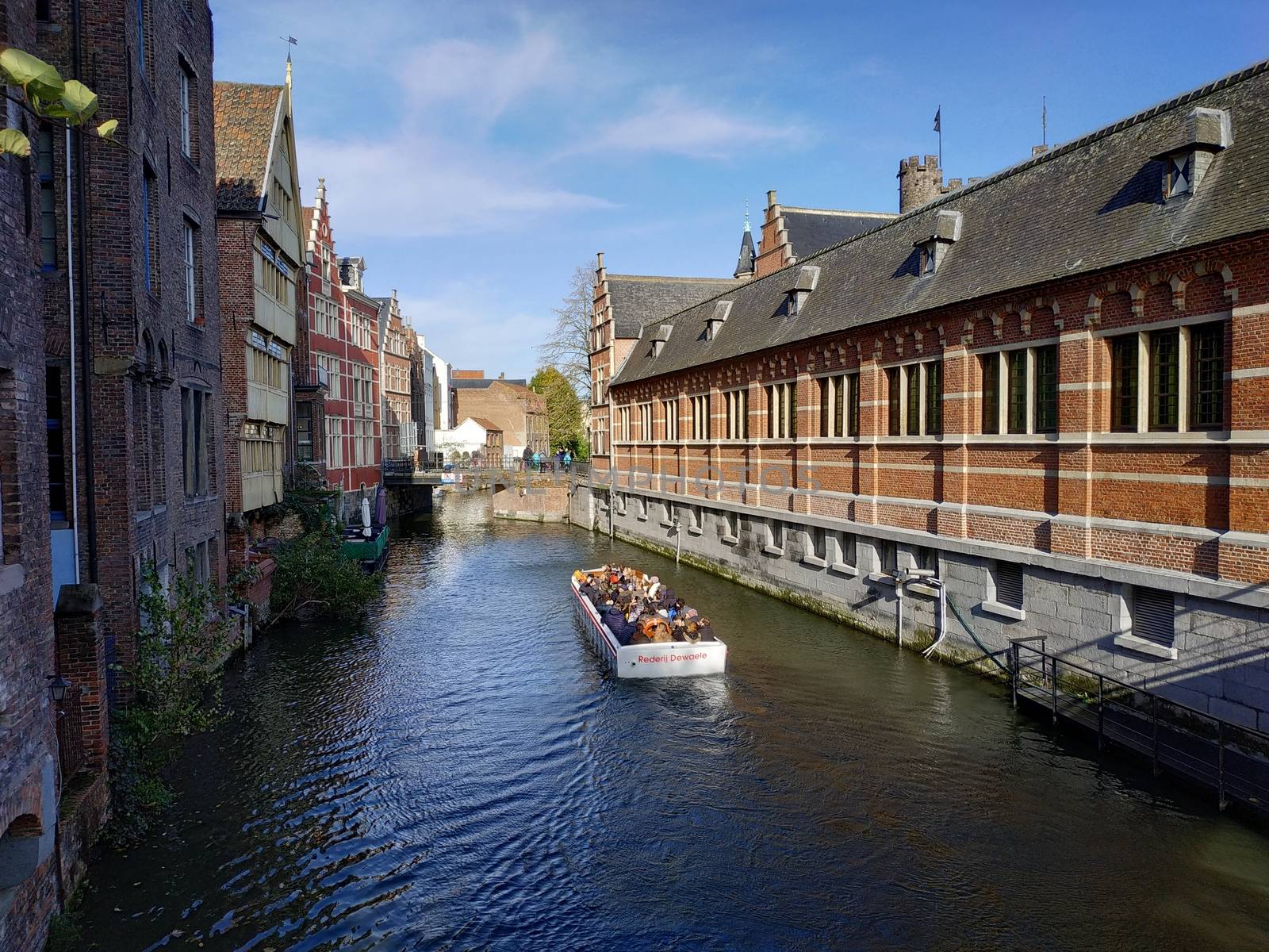 Ghent, Belgium - November 02, 2019: view on the streets and roads with tourists walking around by VIIIPhoto