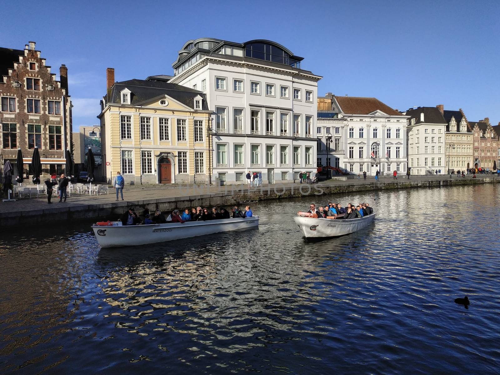 Ghent, Belgium - November 02, 2019: view on the streets and roads with tourists walking around by VIIIPhoto