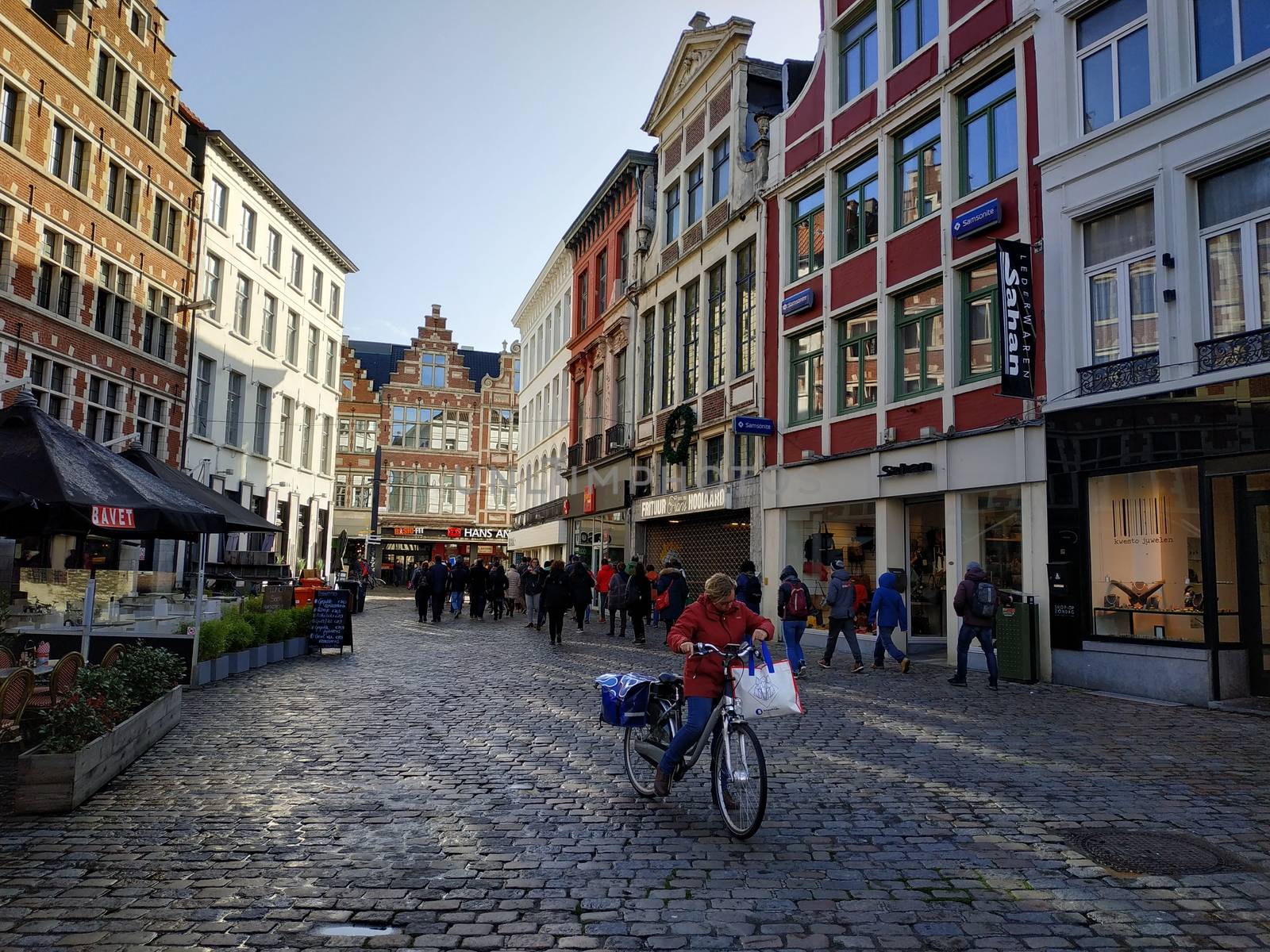 Ghent, Belgium - November 02, 2019: view on the streets and roads with tourists walking around by VIIIPhoto