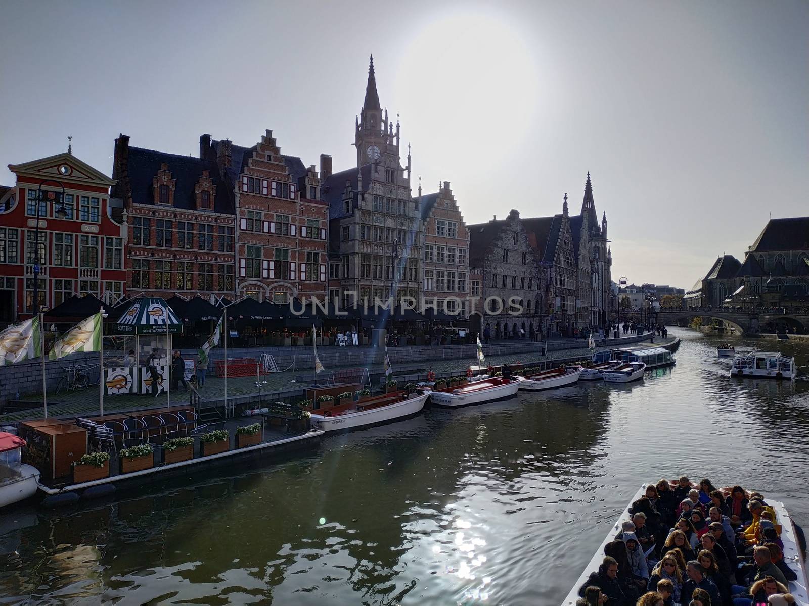 Ghent, Belgium - November 02, 2019: view on the streets and roads with tourists walking around by VIIIPhoto