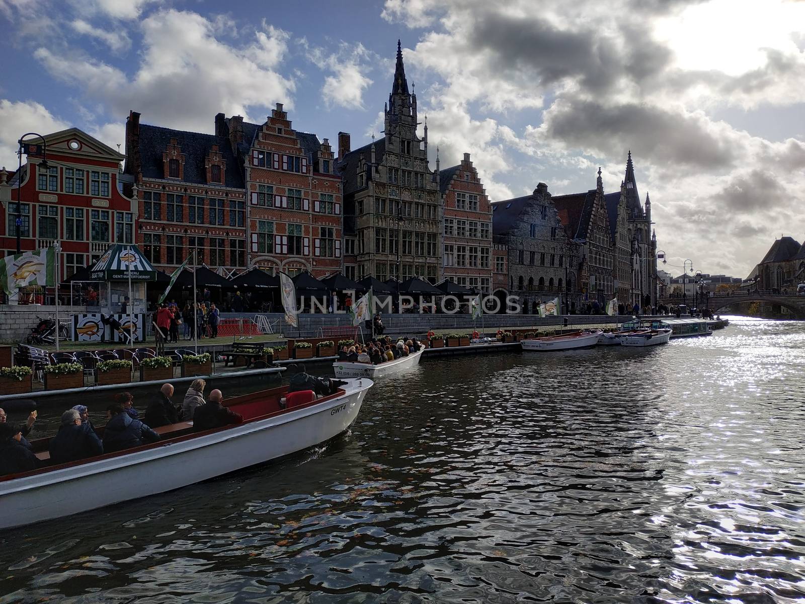 Ghent, Belgium - November 02, 2019: view on the streets and roads with tourists walking around by VIIIPhoto